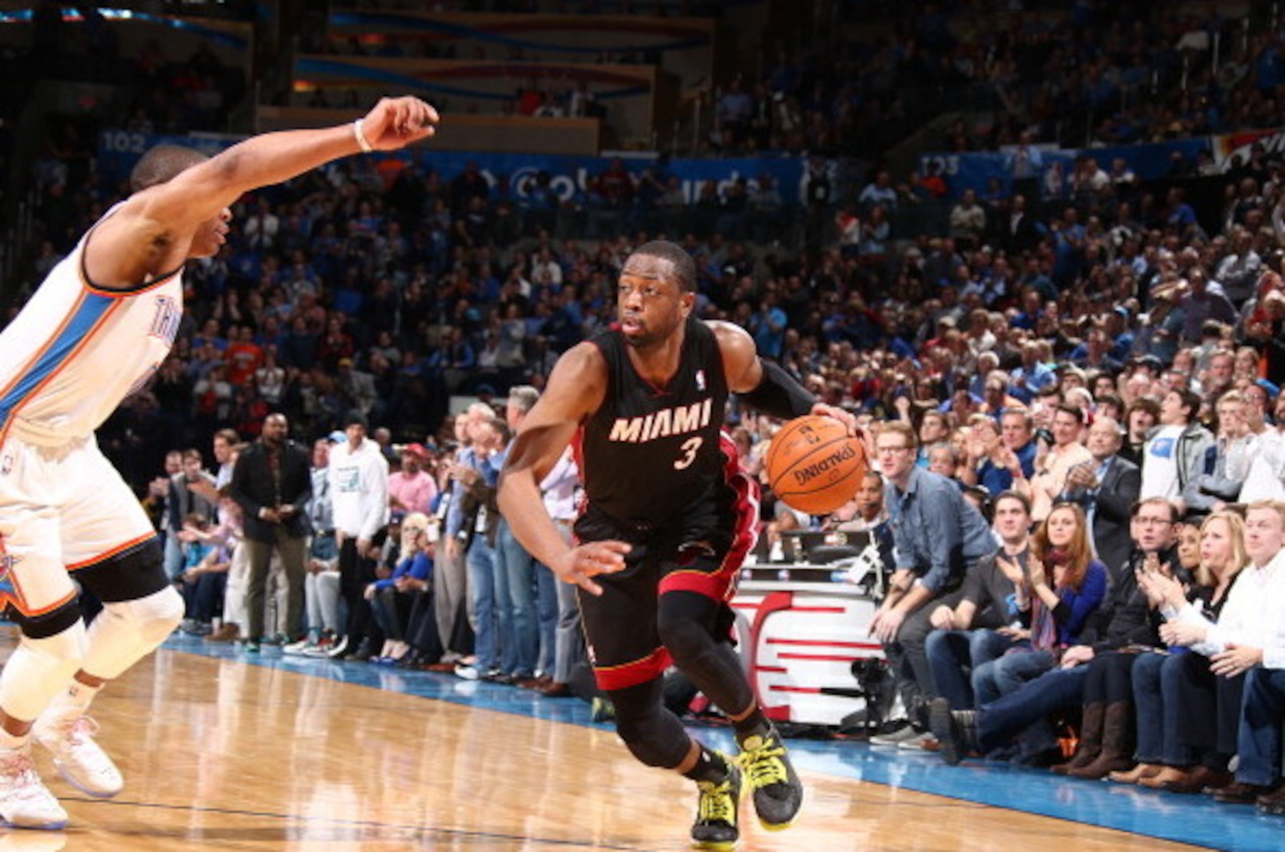 OKLAHOMA CITY, OK - FEBRUARY 20: Dwyane Wade #3 of the Miami Heat drives against Russell Westbrook #0 of the Oklahoma City Thunder during a game at Chesapeake Energy Arena on February 20, 2014 in Oklahoma City, Oklahoma. NOTE TO USER: User expressly ackno