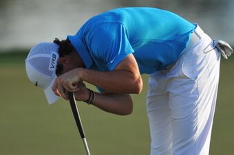 PALM BEACH GARDENS, FL - MARCH 02:  Rory McIlroy of Northern Ireland reacts on the 16th hole during the final round of The Honda Classic at PGA National Resort and Spa on March 2, 2014 in Palm Beach Gardens, Florida.  (Photo by Stuart Franklin/Getty Image