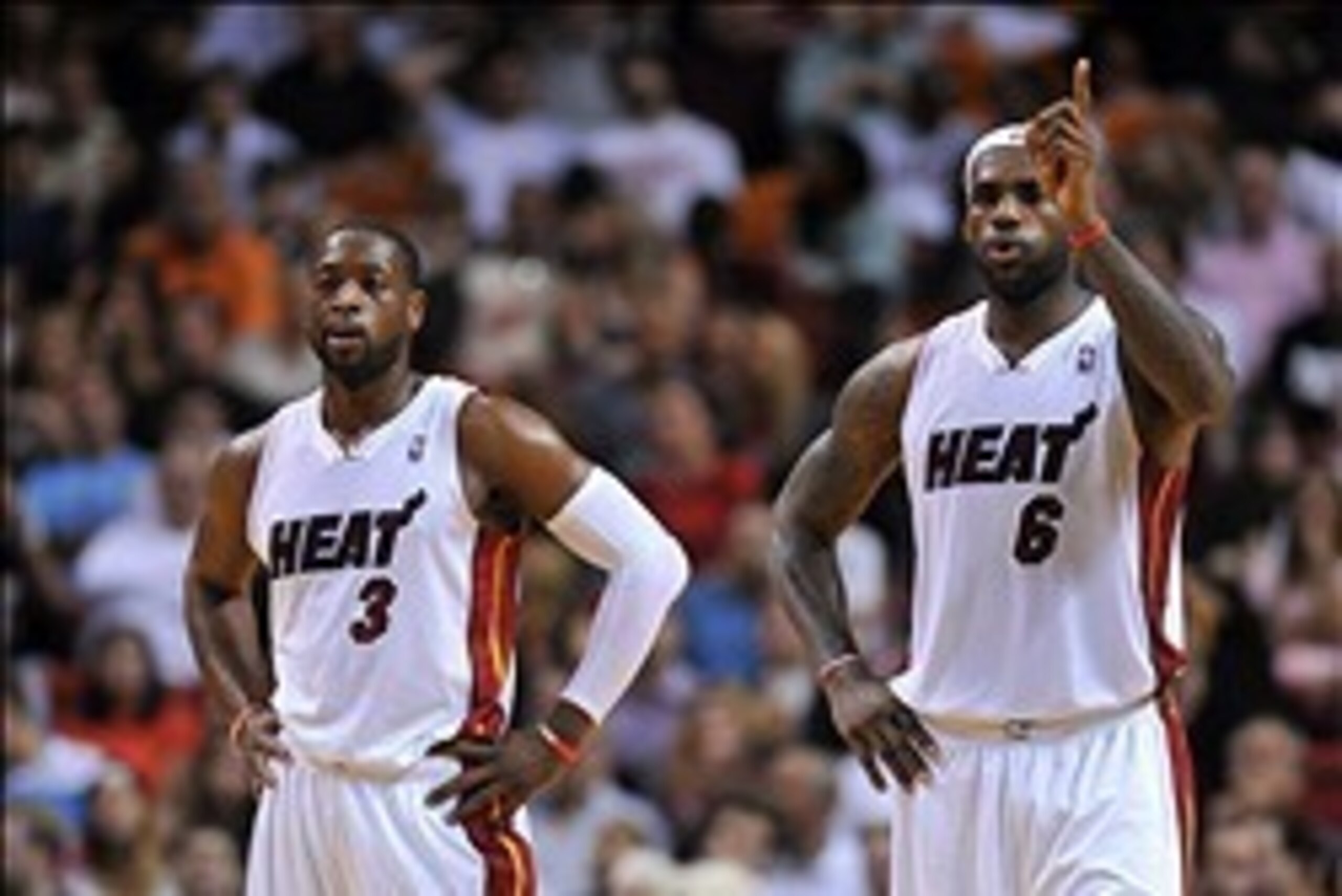 Jan 5, 2014; Miami, FL, USA; Miami Heat shooting guard Dwyane Wade (left) stands next to Miami Heat small forward LeBron James (right) during the second half against the Toronto Raptors at American Airlines Arena. Miami won 102-97. Mandatory Credit: Steve