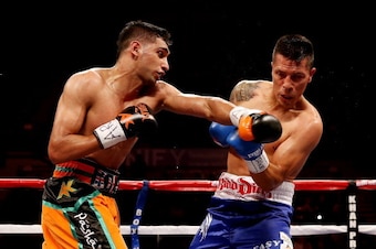 SHEFFIELD, ENGLAND - APRIL 27:  Amir Khan in action against Julio Diaz at Motorpoint Arena on April 27, 2013 in Sheffield, England.  (Photo by Scott Heavey/Getty Images)