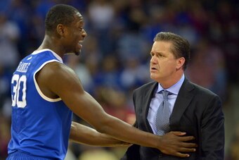 COLUMBIA, SC - MARCH 01: Julius Randle #30 tries to calm Head Coach John Calipari of the Kentucky Wildcats following a technical foul on Calipari during their game against the South Carolina Gamecocks at Colonial Life Arena on March 1, 2014 in Columbia, S
