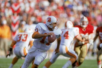 SAN FRANCISCO - NOVEMBER 18:  Quarterback Chris Chandler #17 of the Tampa Bay Buccaneers runs with the ball during a game against the San Francisco 49ers at Candlestick Park on November 18, 1990 in San Francisco, California.  The 49ers won 31-7.  (Photo b
