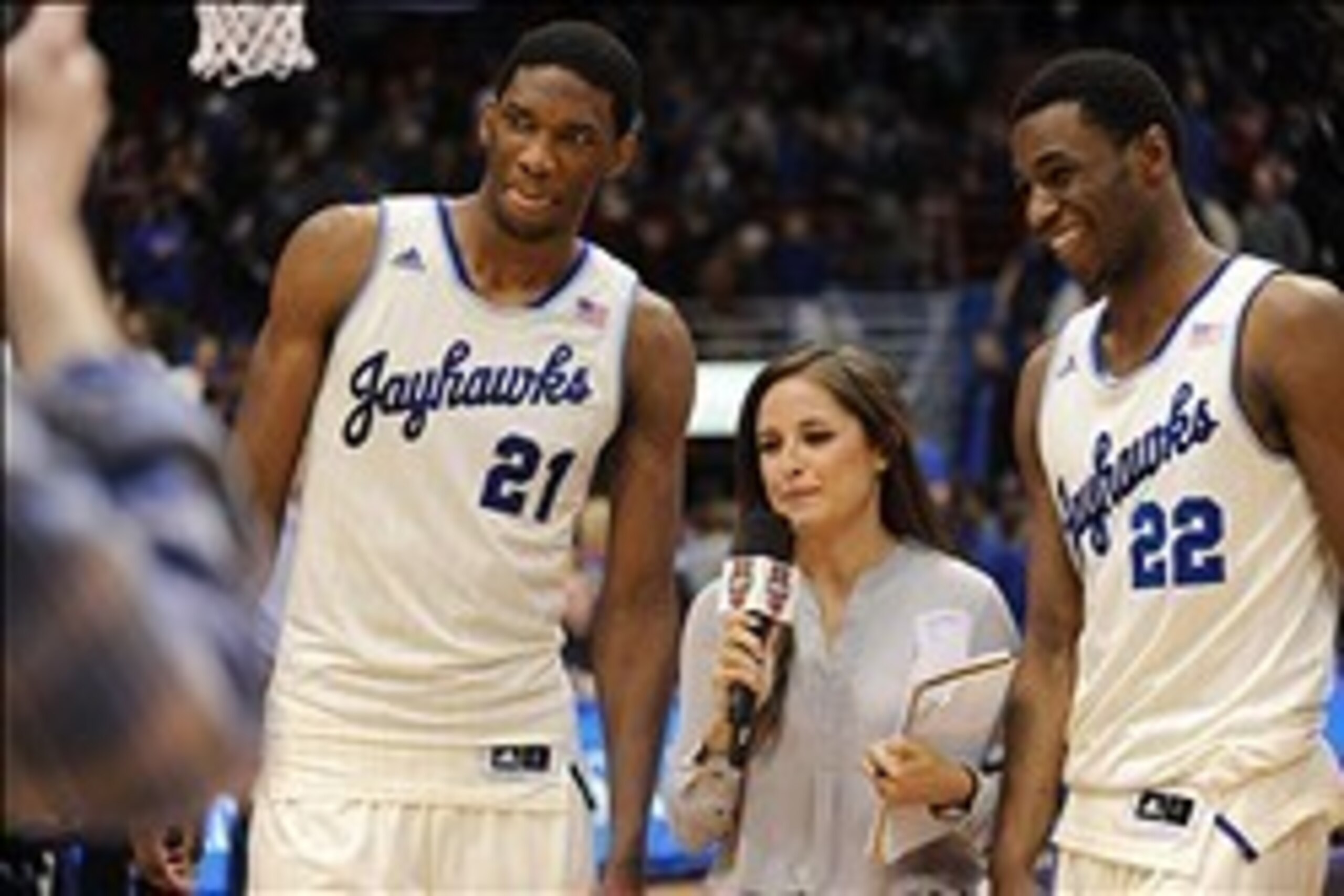 Feb 22, 2014; Lawrence, KS, USA; Kansas Jayhawks center Joel Embiid (21) and guard Andrew Wiggins (22) speak with media after the game against the Texas Longhorns at Allen Fieldhouse. Kansas won 85-54. Mandatory Credit: Denny Medley-USA TODAY Sports