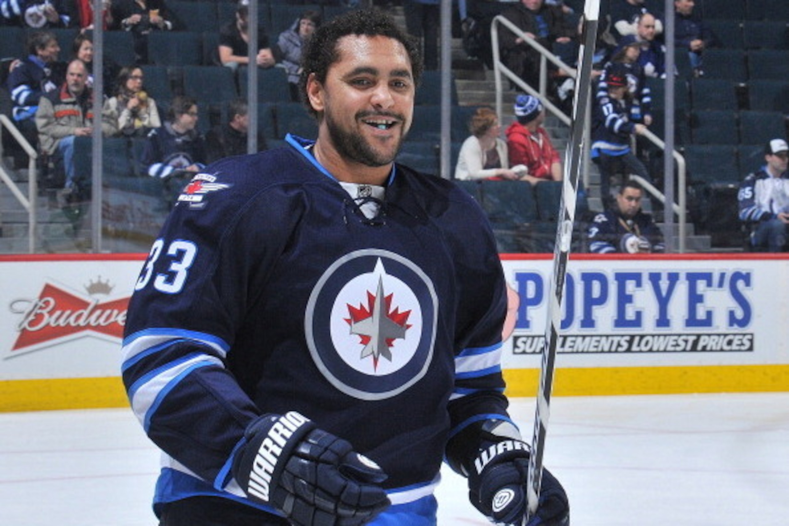 WINNIPEG, MB - JANUARY 25: Dustin Byfuglien #33 of the Winnipeg Jets smiles as he takes part in the pre-game warm up prior to NHL action against the Toronto Maple Leafs at the MTS Centre on January 25, 2014 in Winnipeg, Manitoba, Canada. (Photo by Lance T