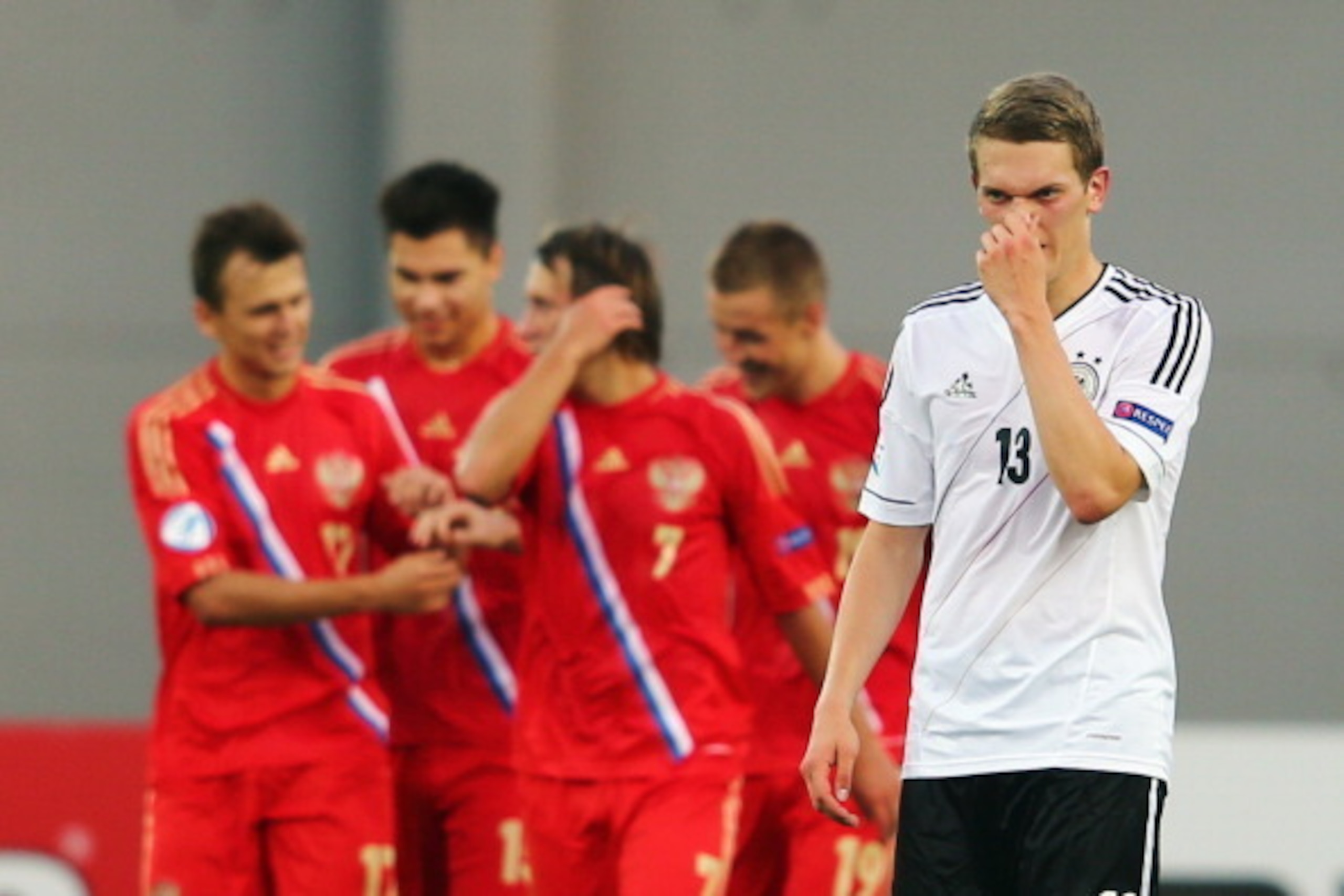 NETANYA, ISRAEL - JUNE 12: Matthias Ginter of Germany reacts after Alan Dzagoev of Russia scored his team's first goal during the UEFA European U21 Championship Group B match between Russia and Germany at Netanya Stadium on June 12, 2013 in Netanya, Israe