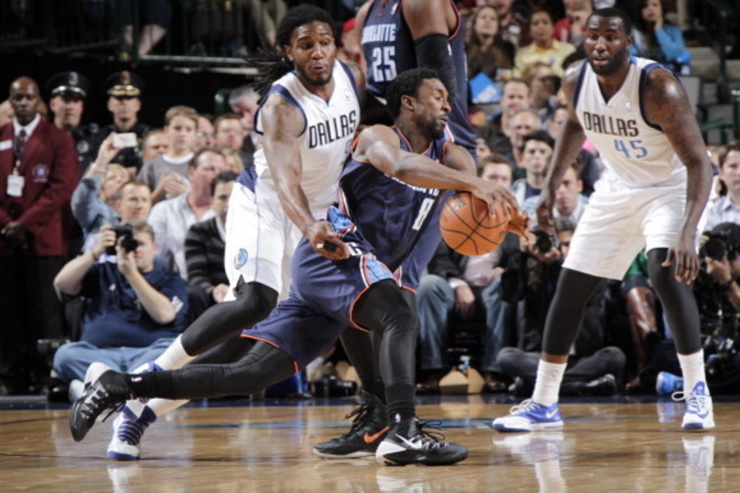 DALLAS, TX - DECEMBER 3: Ben Gordon #8 of the Charlotte Bobcats drives against Jae Crowder #9 of the Dallas Mavericks on December 3, 2013 at the American Airlines Center in Dallas, Texas. NOTE TO USER: User expressly acknowledges and agrees that, by downl