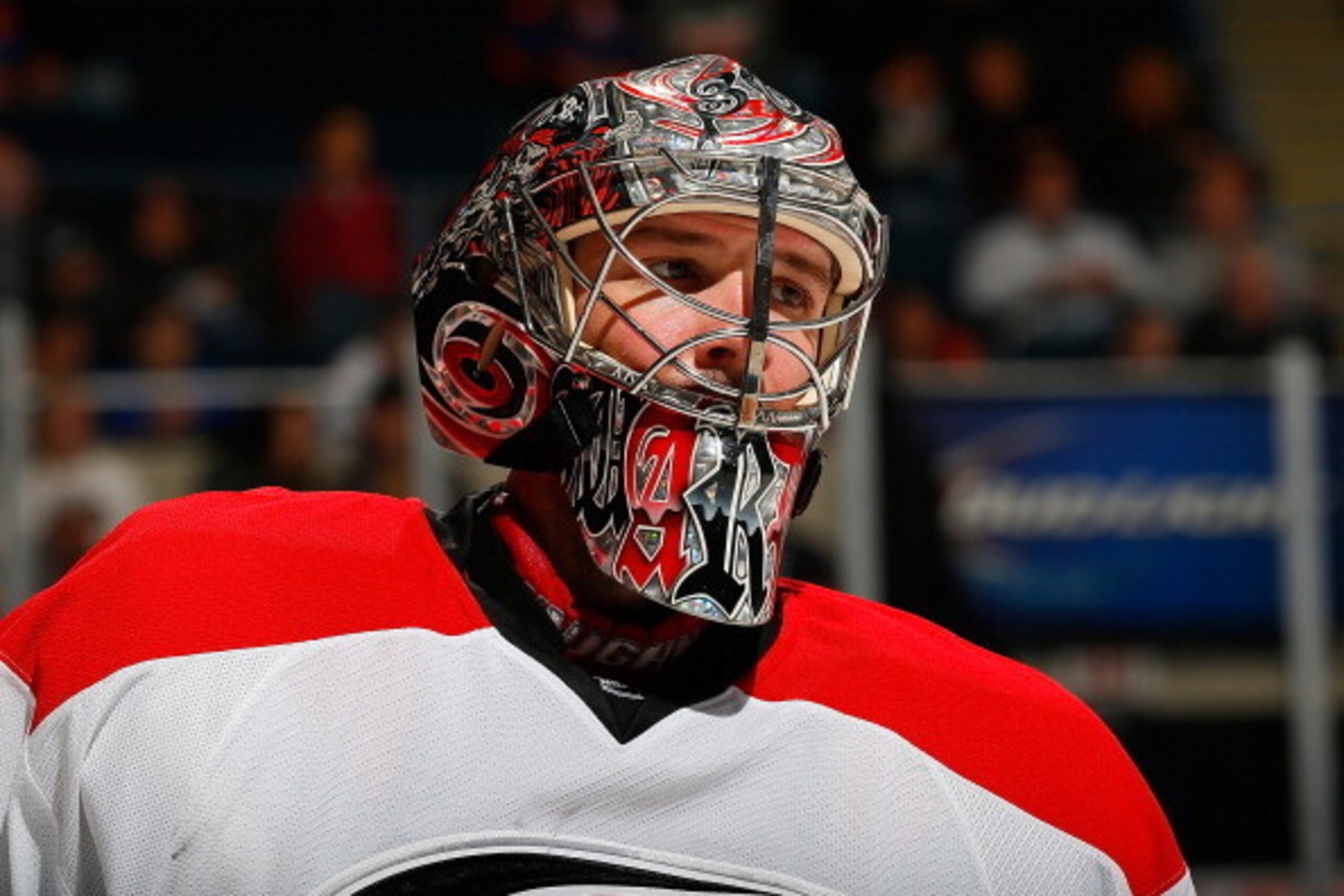 UNIONDALE, NY - OCTOBER 19:  Cam Ward #30 of the Carolina Hurricanes skates against the New York Islanders at Nassau Veterans Memorial Coliseum on October 19, 2013 in Uniondale, New York. The Hurricanes defeated the Islanders 4-3.  (Photo by Mike Stobe/NH