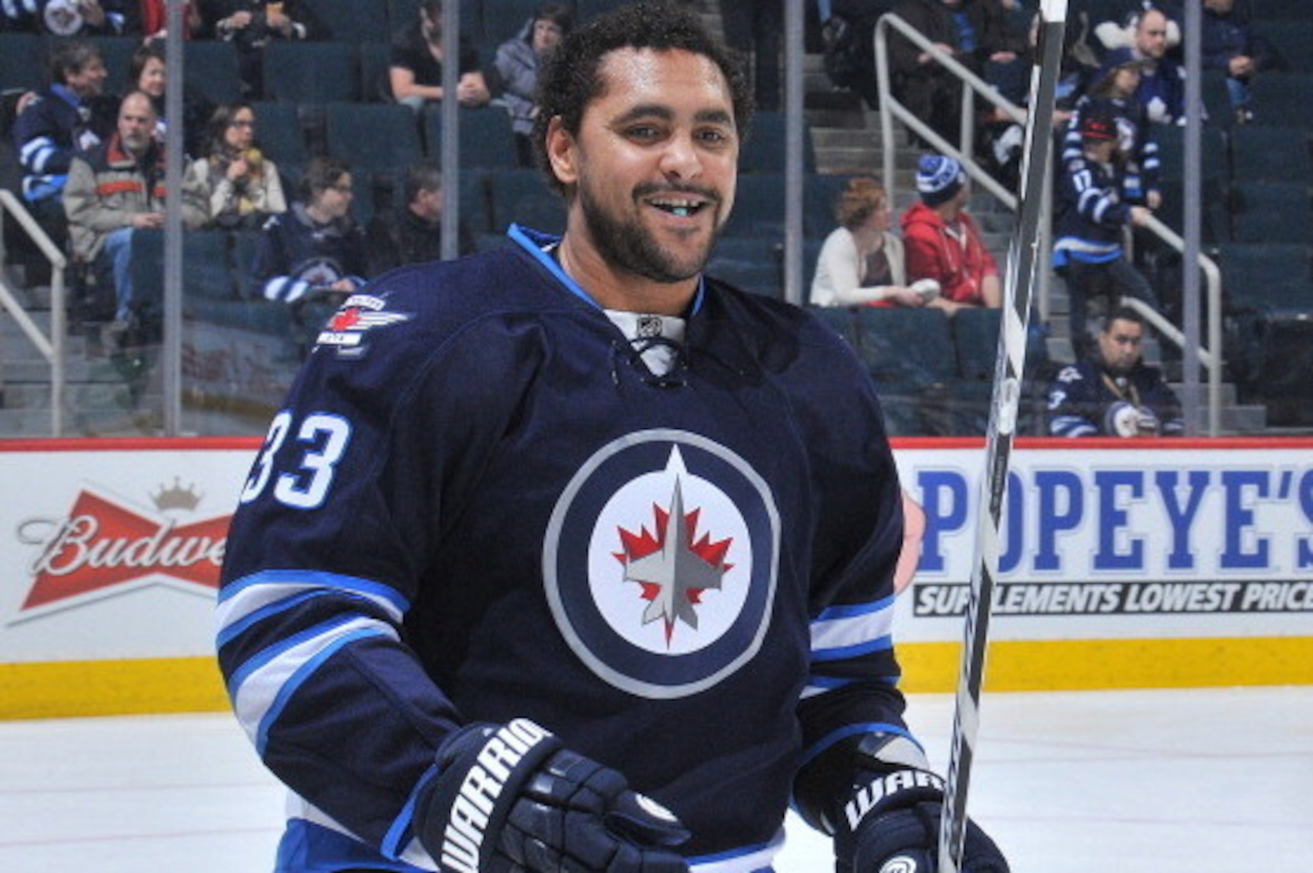 WINNIPEG, MB - JANUARY 25: Dustin Byfuglien #33 of the Winnipeg Jets smiles as he takes part in the pre-game warm up prior to NHL action against the Toronto Maple Leafs at the MTS Centre on January 25, 2014 in Winnipeg, Manitoba, Canada. (Photo by Lance T