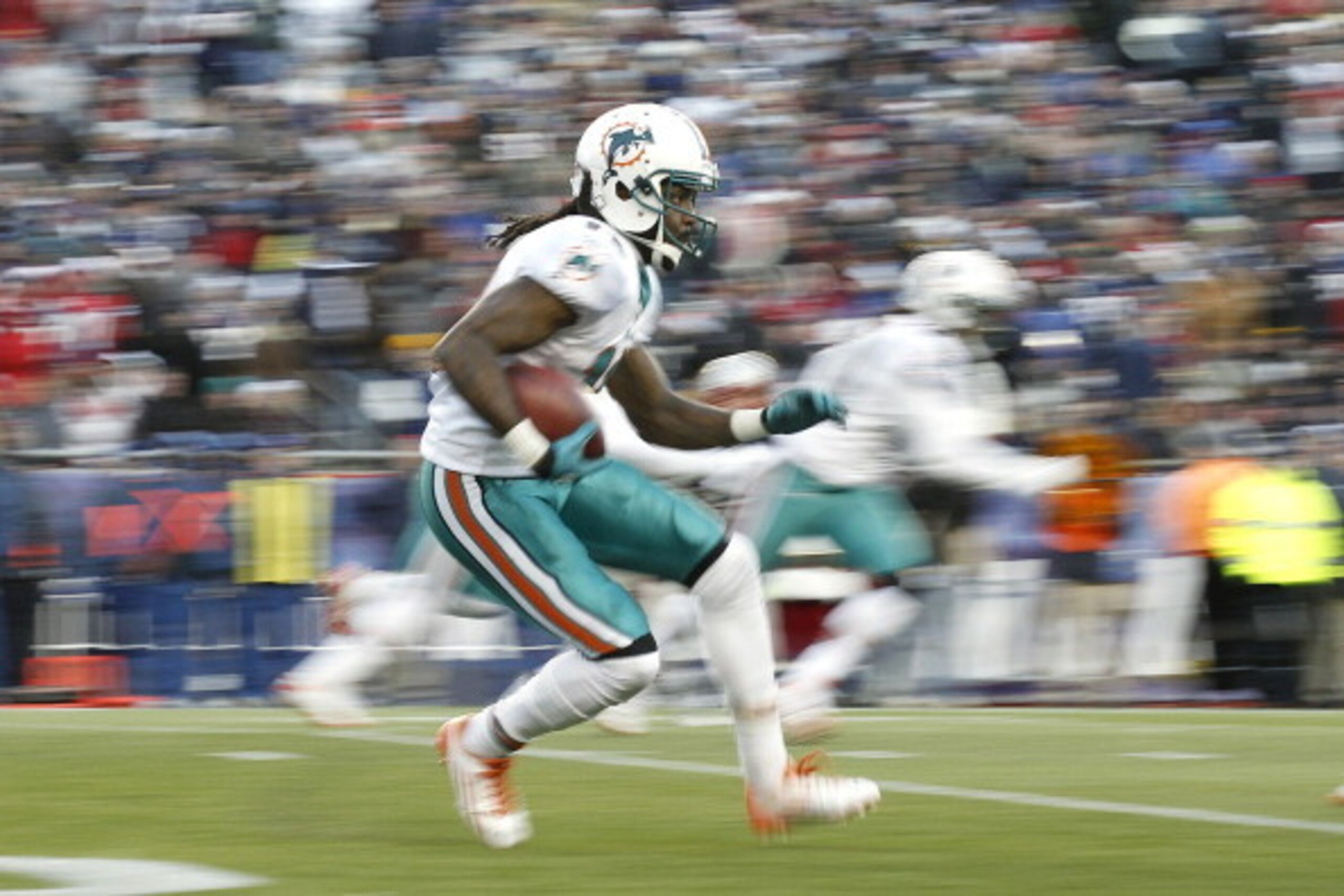 FOXBORO, MA - DECEMBER 24: Clyde Gates #10 of the Miami Dolphins looks for an opening on a runback during the second half of New England's 27-24 win at Gillette Stadium on December 24, 2011 in Foxboro, Massachusetts. (Photo by Winslow Townson/Getty Imag FOXBORO, MA - DECEMBER 24: Clyde Gates #10 of the Miami Dolphins looks for an opening on a runback during the second half of New England's 27-24 win at Gillette Stadium on December 24, 2011 in Foxboro, Massachusetts. (Photo by Winslow Townson/Getty Imag