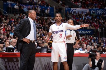 LOS ANGELES, CA - FEBRUARY 26: Head coach Doc Rivers of the Los Angeles Clippers and Chris Paul #3 talk to each other during their game against the Houston Rockets at Staples Center on February 26, 2014 in Los Angeles, California. NOTE TO USER: User expre