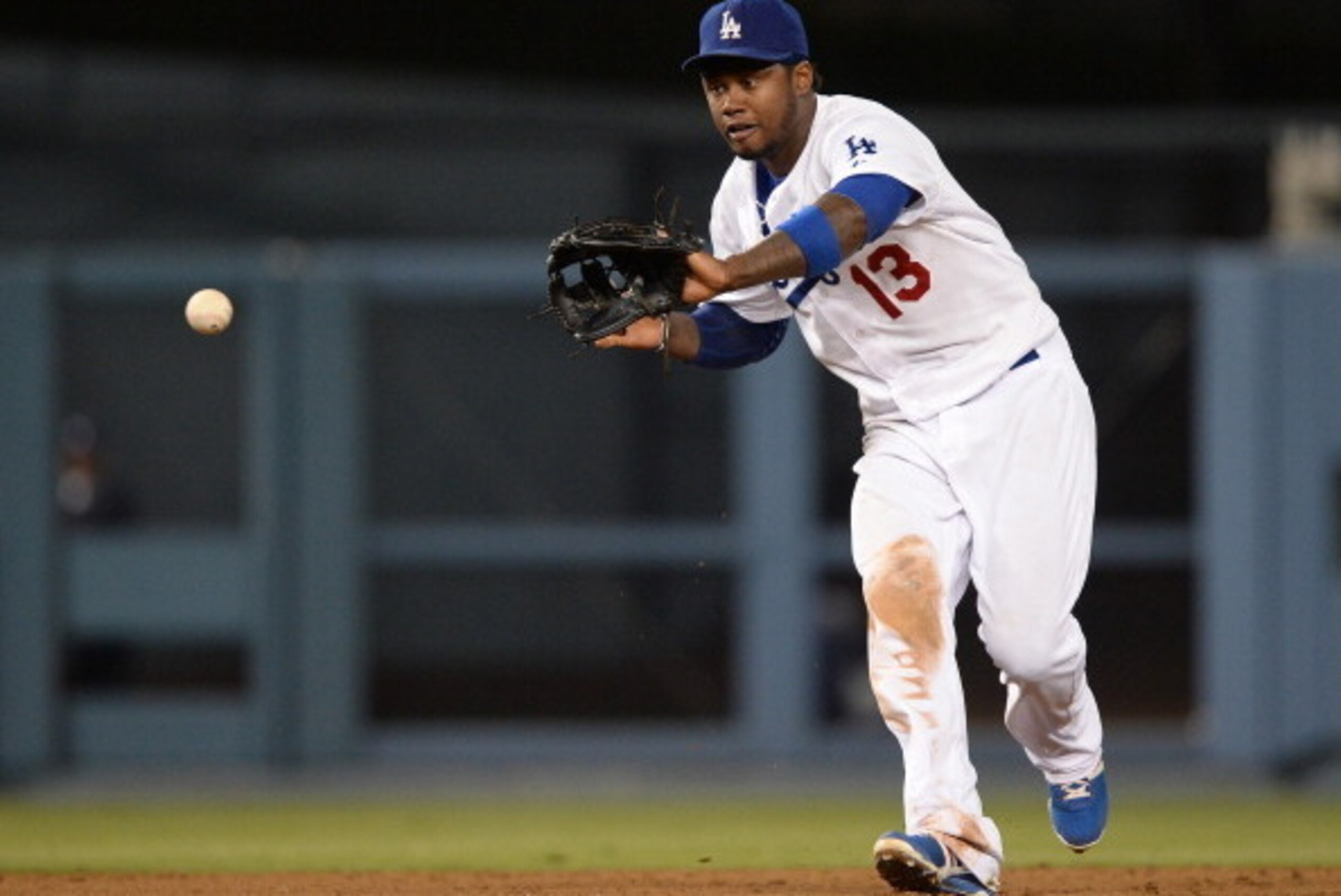 LOS ANGELES, CA - JULY 30:  Hanley Ramirez #13 of the Los Angeles Dodgers makes a play on an Chris Stewart #19 of the New York Yankees groundball to end the seventh inning at Dodger Stadium on July 30, 2013 in Los Angeles, California.  (Photo by Harry How