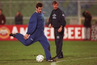 22 NOV 1994:  ERIC CANTONA OF MANCHESTER UNITED FIRES A SHOT AT GOAL DURING TRAINING TODAY AS CLUB MANAGER ALEX FERGUSON WATCHES IN THE BACKGROUND. CANTONA RETURNS TO THE SQUAD FOR THE EUROOEAN CHAMPIONS LEAGUE MATCH AGAINST GOTHENBURG TOMORROW AFTER A LO