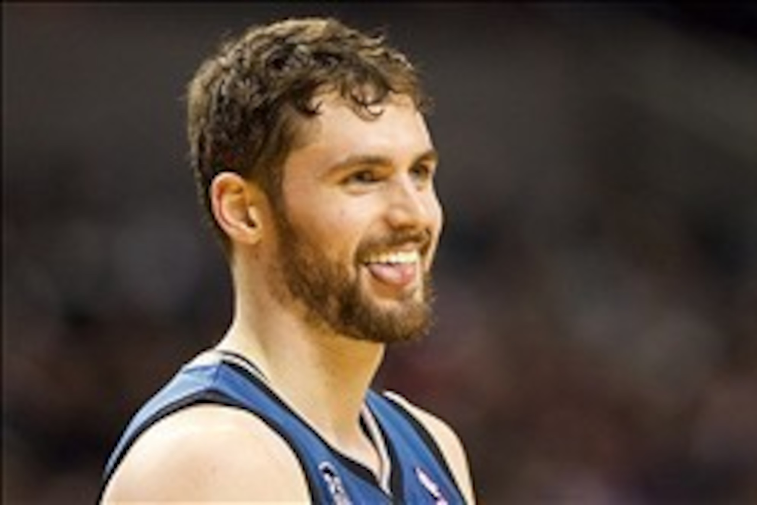 Feb 23, 2014; Portland, OR, USA;  Minnesota Timberwolves power forward Kevin Love (42) reacts with a smile after being called for a foul against against the Portland Trail Blazers in the second half at Moda Center. Mandatory Credit: Jaime Valdez-USA TODAY