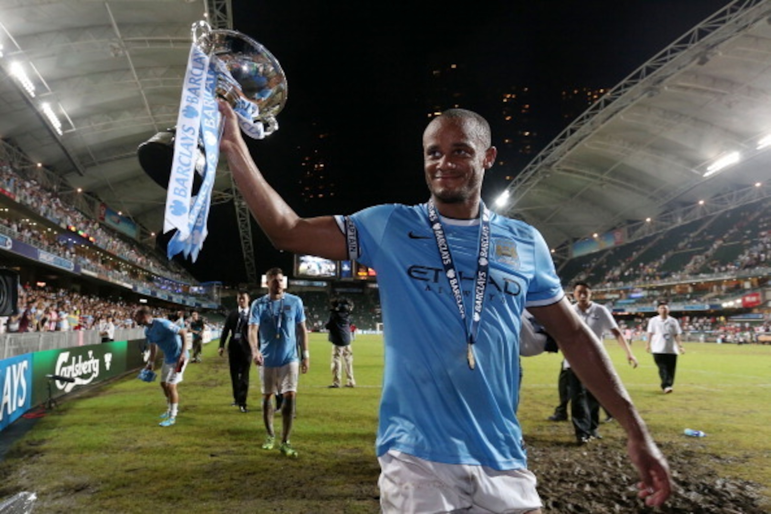SO KON PO, HONG KONG - JULY 27:  Vincent Kompany #4 of Manchester City celebrates with the trophy during the Barclays Asia Trophy Final match between Manchester City and Sunderland at Hong Kong Stadium on July 27, 2013 in So Kon Po, Hong Kong.  (Photo by 