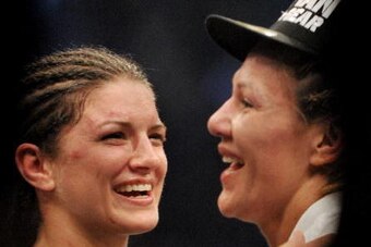 SAN JOSE, CA - AUGUST 15:  Gina Carano (L) congratulates Cris Cyborg (R) after being defeated for the Middleweight  Championship Title at Stikeforce: Carano vs. Cyborg on August 15, 2009 in San Jose, California.  (Photo by Jon Kopaloff/Getty Images)