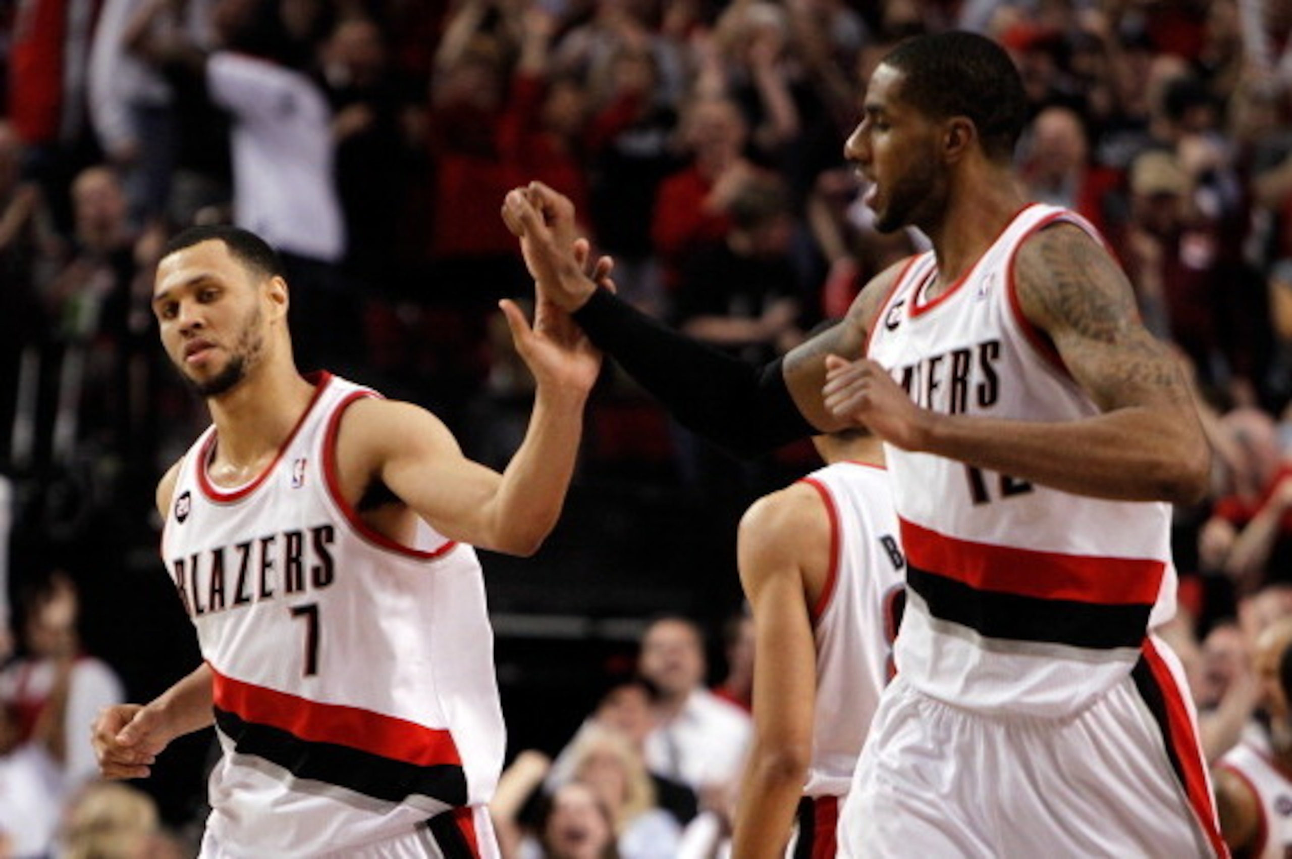 PORTLAND, OR - APRIL 23:  Brandon Roy #7 high fives LaMarcus Aldridge #12 of the Portland Trail Blazers against the Dallas Mavericks in Game Four of the Western Conference Quarterfinals in the 2011 NBA Playoffs on April 23, 2011 at the Rose Garden in Port