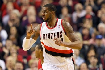 Feb 1, 2014; Portland, OR, USA; Portland Trail Blazers power forward LaMarcus Aldridge (12) raises his finger to a teammate after making a basket against Toronto Raptors in the first half at Moda Center. Mandatory Credit: Jaime Valdez-USA TODAY Sports