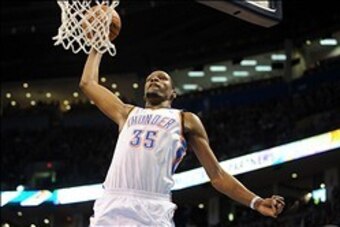 Feb 23, 2014; Oklahoma City, OK, USA; Oklahoma City Thunder small forward Kevin Durant (35) dunks the ball against the Los Angeles Clippers during the fourth quarter at Chesapeake Energy Arena. Mandatory Credit: Mark D. Smith-USA TODAY Sports