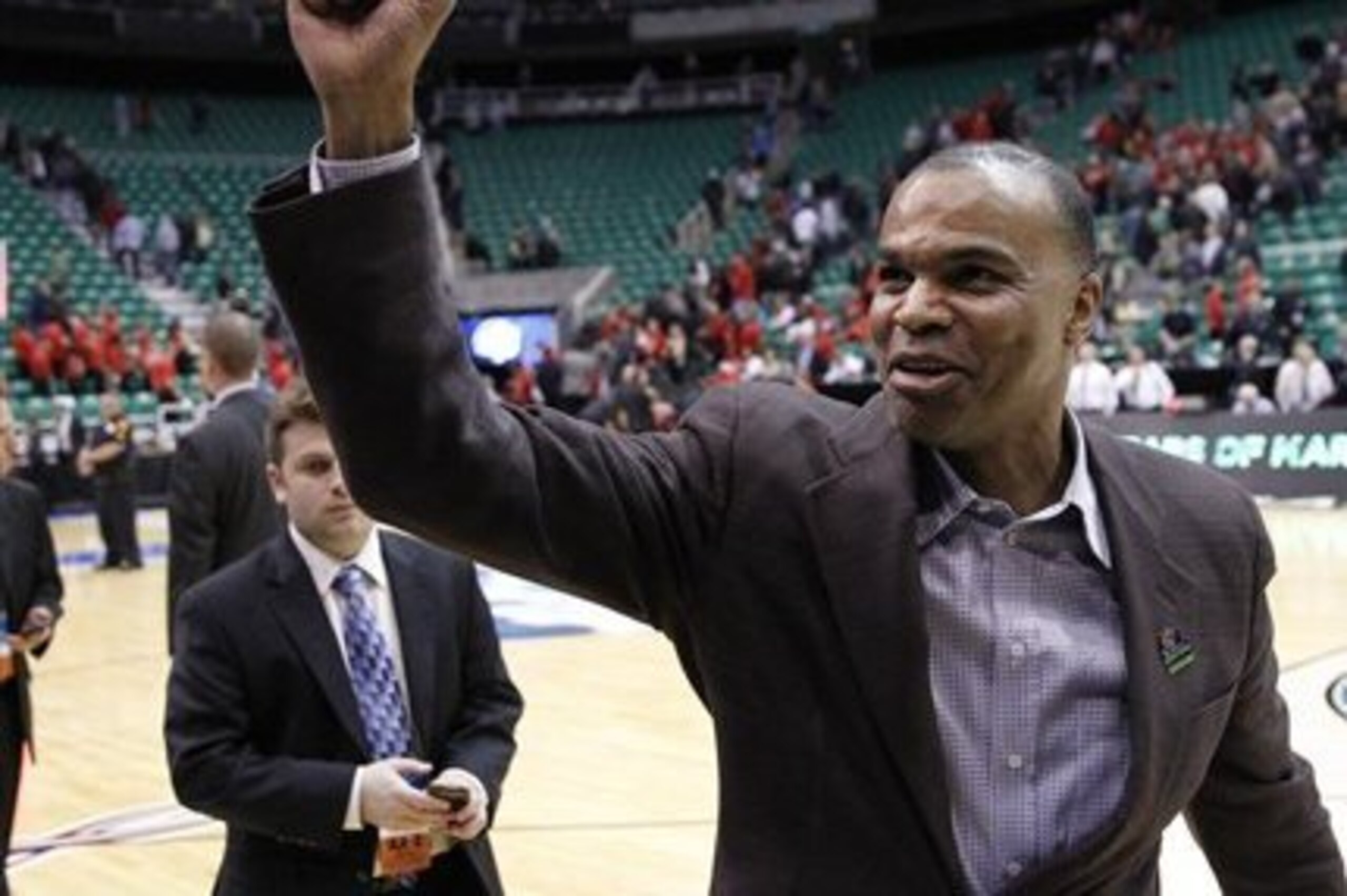Harvard head coachTommy Amaker celebrates after his team defeated New Mexico New Mexico 68-62 during a second-round game in the NCAA college basketball tournament in Salt Lake City Thursday, March 21, 2013. (AP Photo/Rick Bowmer)