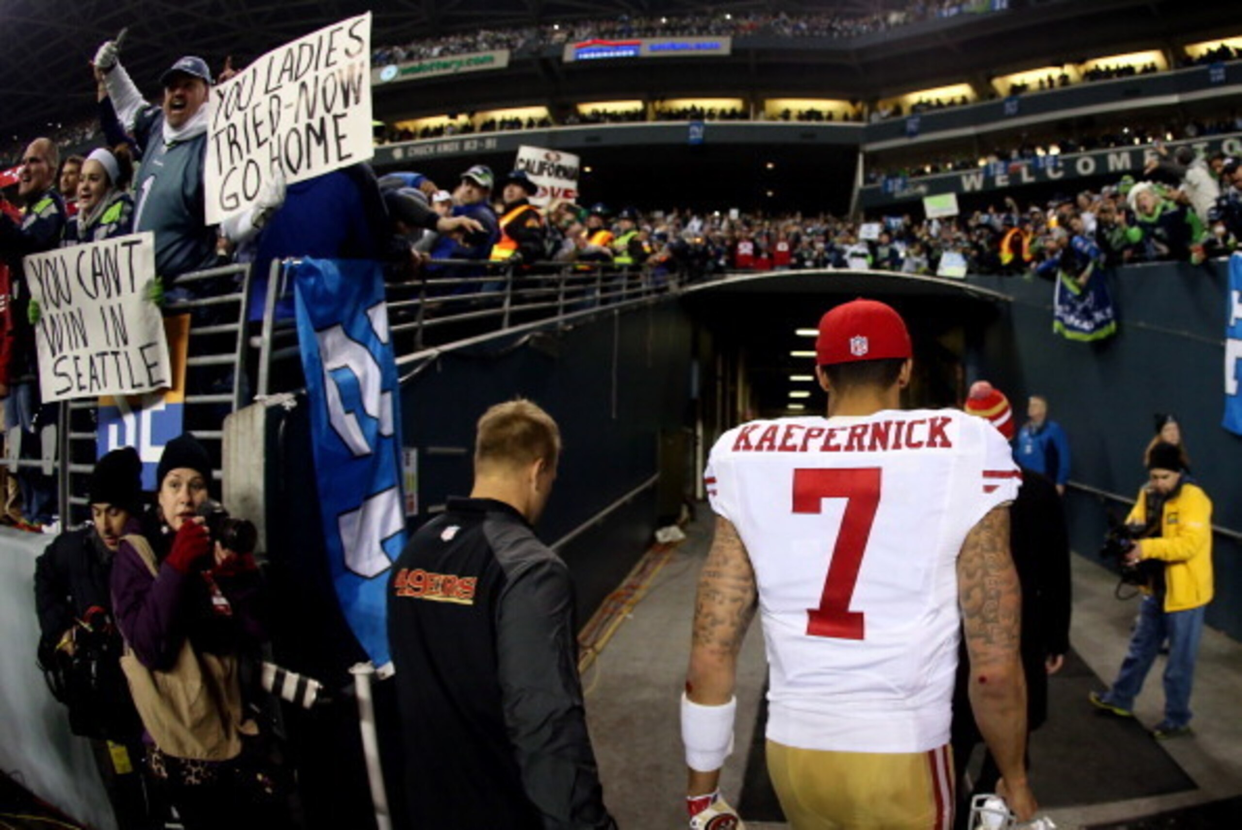 SEATTLE, WA - JANUARY 19:  Quarterback Colin Kaepernick #7 of the San Francisco 49ers walks off the field after losing to the Seattle Seahawks 23-17 in the 2014 NFC Championship at CenturyLink Field on January 19, 2014 in Seattle, Washington.  (Photo by C