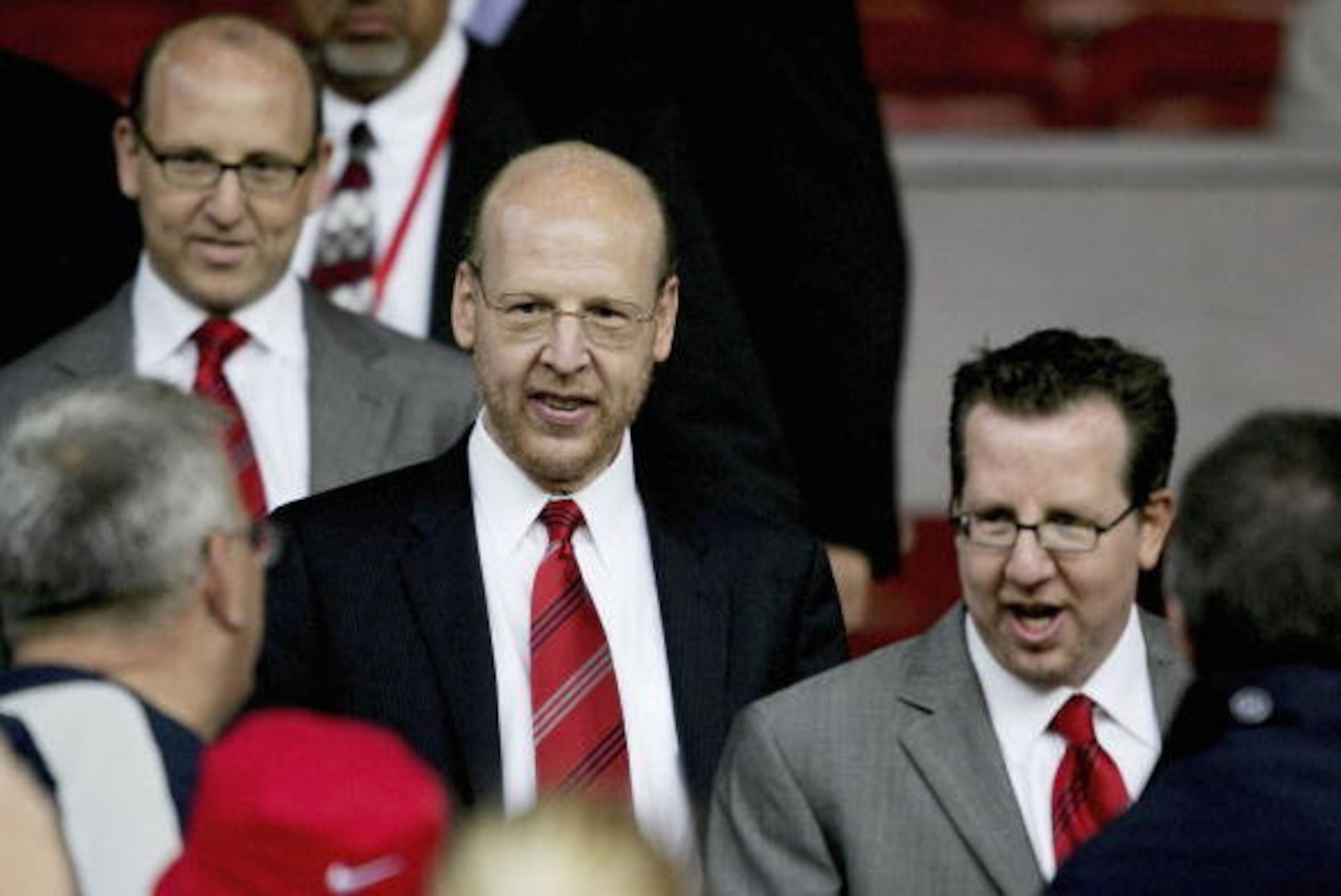 MANCHESTER, ENGLAND-AUGUST 9 : (L to R) Joel Glazer, Avram Glazer and Bryan Glazer, sons of owner Malcolm Glazer, are seen before the Champions League third qualifying round, first leg match between Manchester United and Debreceni VSC at Old Trafford on A