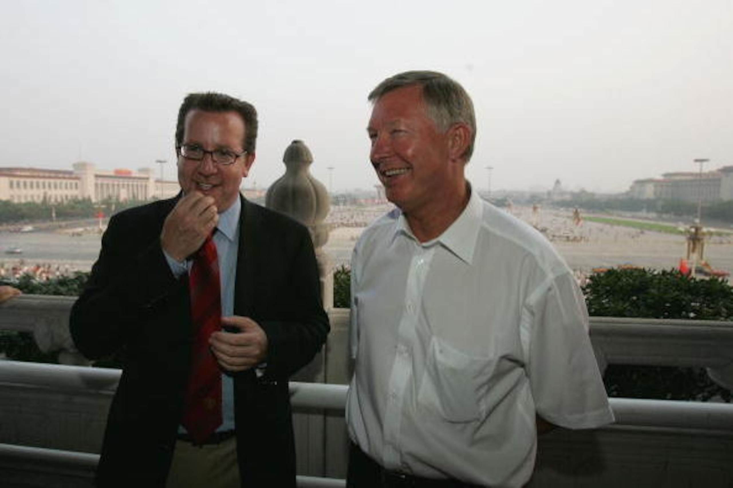 BEIJING, CHINA - JULY 25: (CHINA OUT) Bryan Glazer (L), son of new Manchester United owner Malcolm Glazer, chats with Sir Alex Ferguson as they visit the Tiananmen Gate with the team on July 25, 2005 in Beijing, China. Manchester United are in China's cap