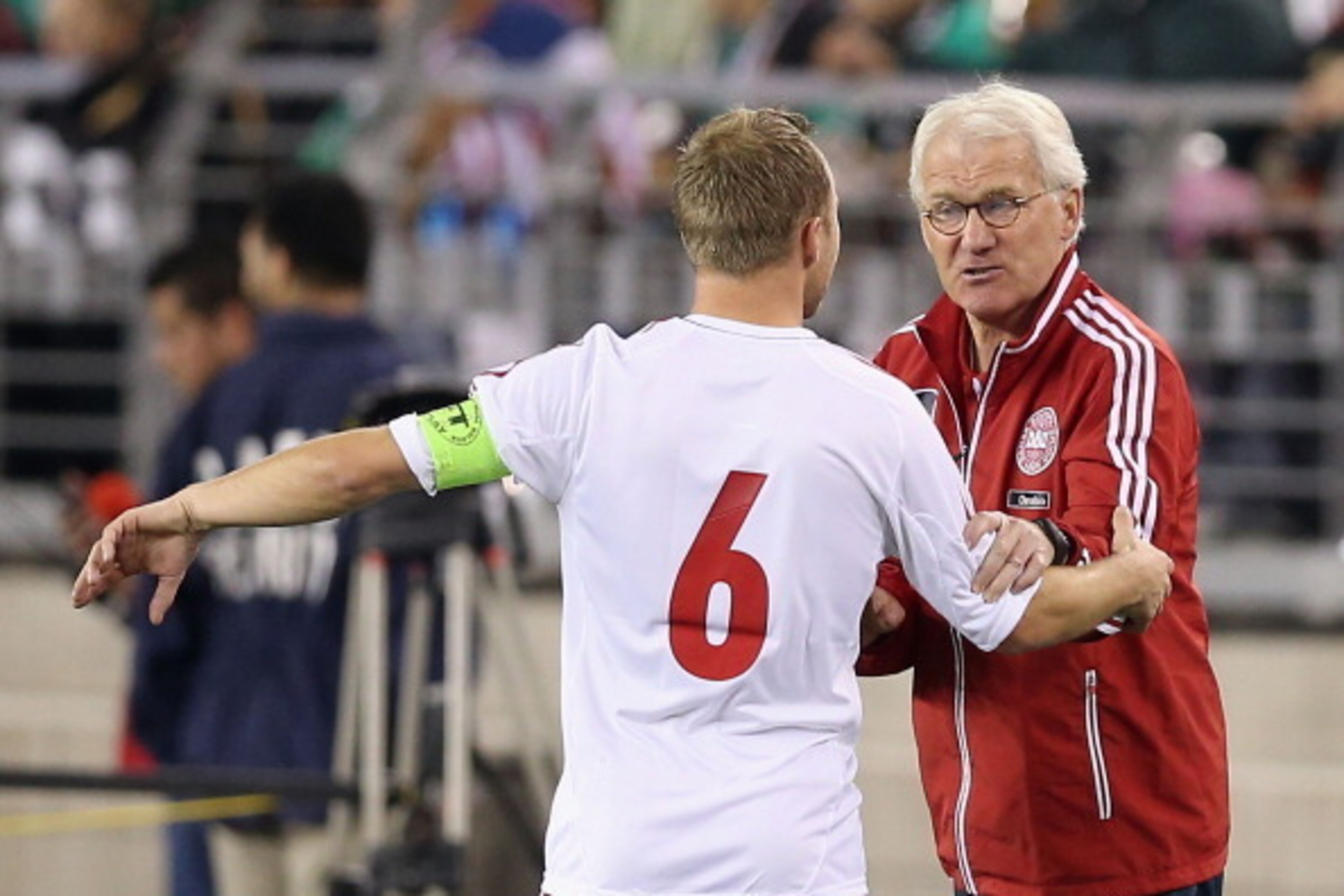 GLENDALE, AZ - JANUARY 30:  Head coach Morten Olsen of Denmark talks with Lars Jacobsen #6 during an international friendly match against Mexico at University of Phoenix Stadium on January 30, 2013 in Glendale, Arizona. Mexico and Denmark ended in a 1-1 d