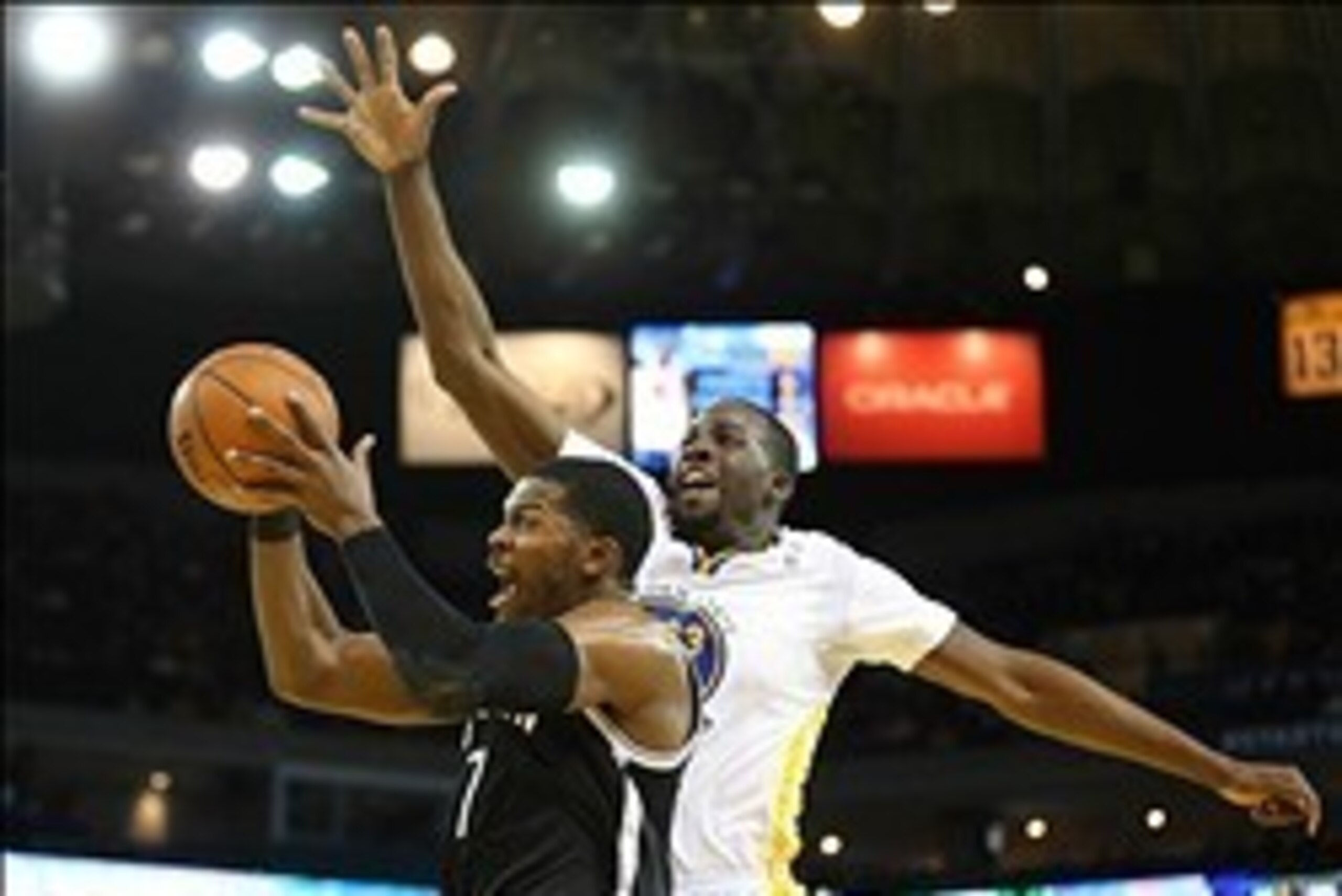 Feb 22, 2014; Oakland, CA, USA; Brooklyn Nets shooting guard Joe Johnson (7) shoots the ball against Golden State Warriors small forward Draymond Green (23) during the first quarter at Oracle Arena. Mandatory Credit: Kelley L Cox-USA TODAY Sports