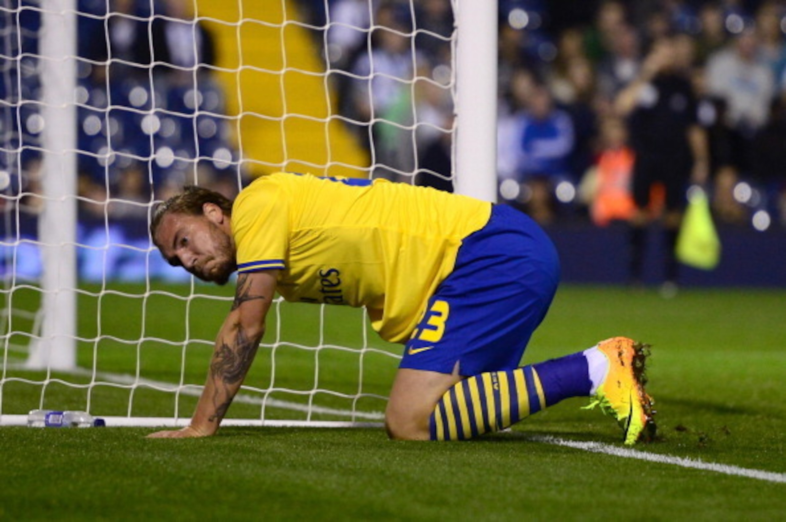 WEST BROMWICH, ENGLAND - SEPTEMBER 25:  Nicklas Bendtner of Arsenal goes down injured during the Capital One Cup third round match between West Bromwich Albion and Arsenal at The Hawthorns on September 25, 2013 in West Bromwich, England.  (Photo by Jamie 