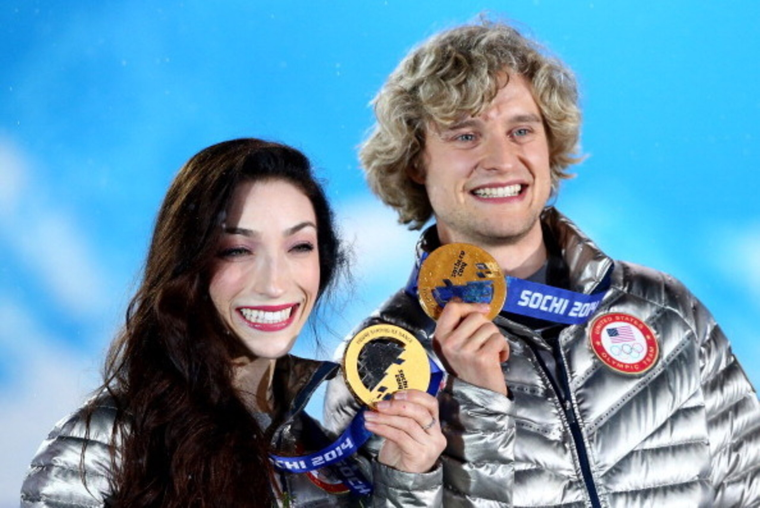 SOCHI, RUSSIA - FEBRUARY 18:  Gold medalists Meryl Davis (L) and Charlie White of the United States celebrate during the medal ceremony for the Figure Skating Ice Danceon day 11 of the Sochi 2014 Winter Olympics at Medals Plaza on February 18, 2014 in Soc