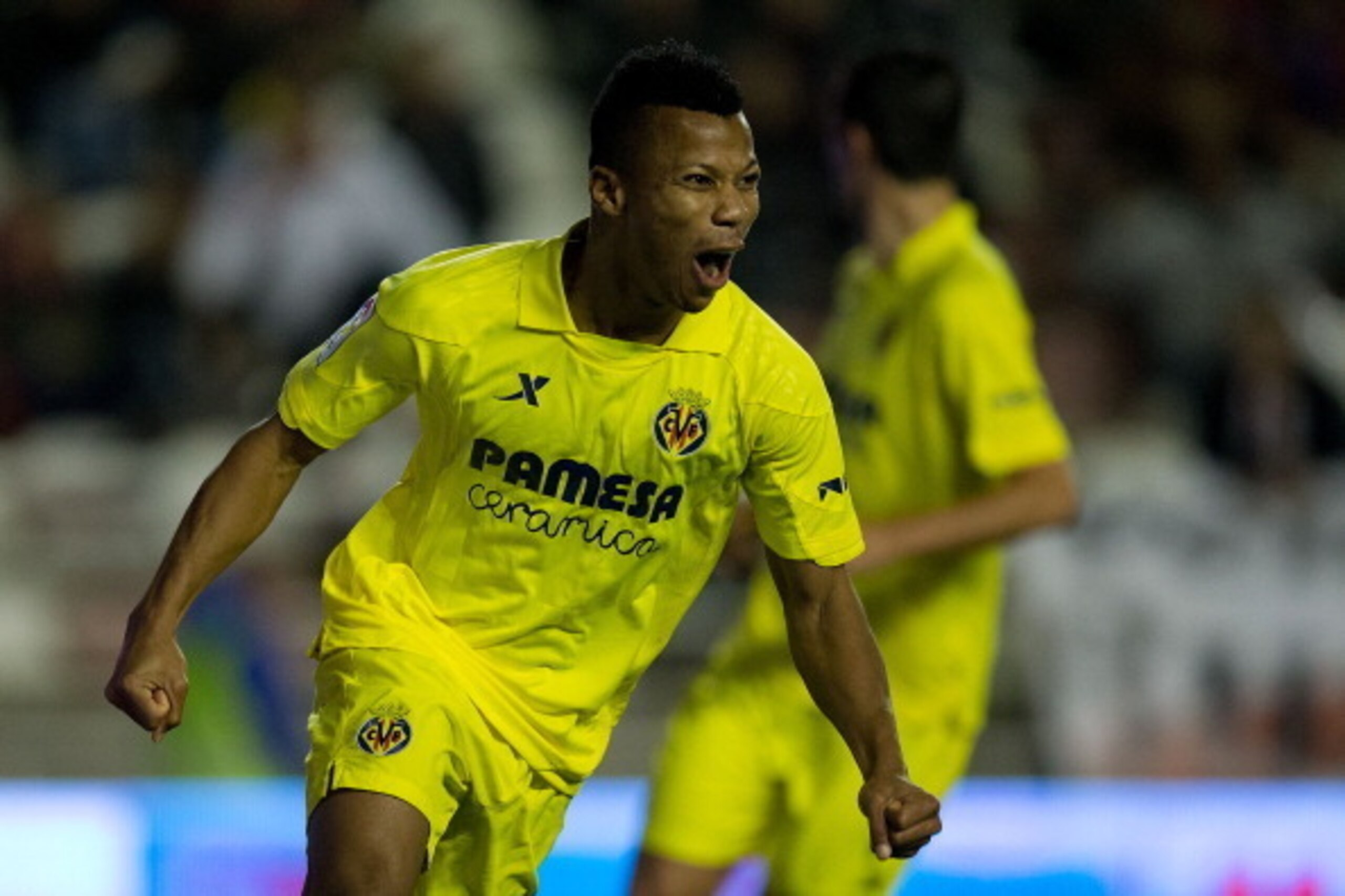 MADRID, SPAIN - JANUARY 06: Ikechukwu Uche of Villarreal CF celebrates scoring their fifth goal during the La Liga match between Rayo Vallecano de Madrid and Villarreal CF at Estadio de Vallecas on January 6, 2014 in Madrid, Spain.  (Photo by Gonzalo Arro