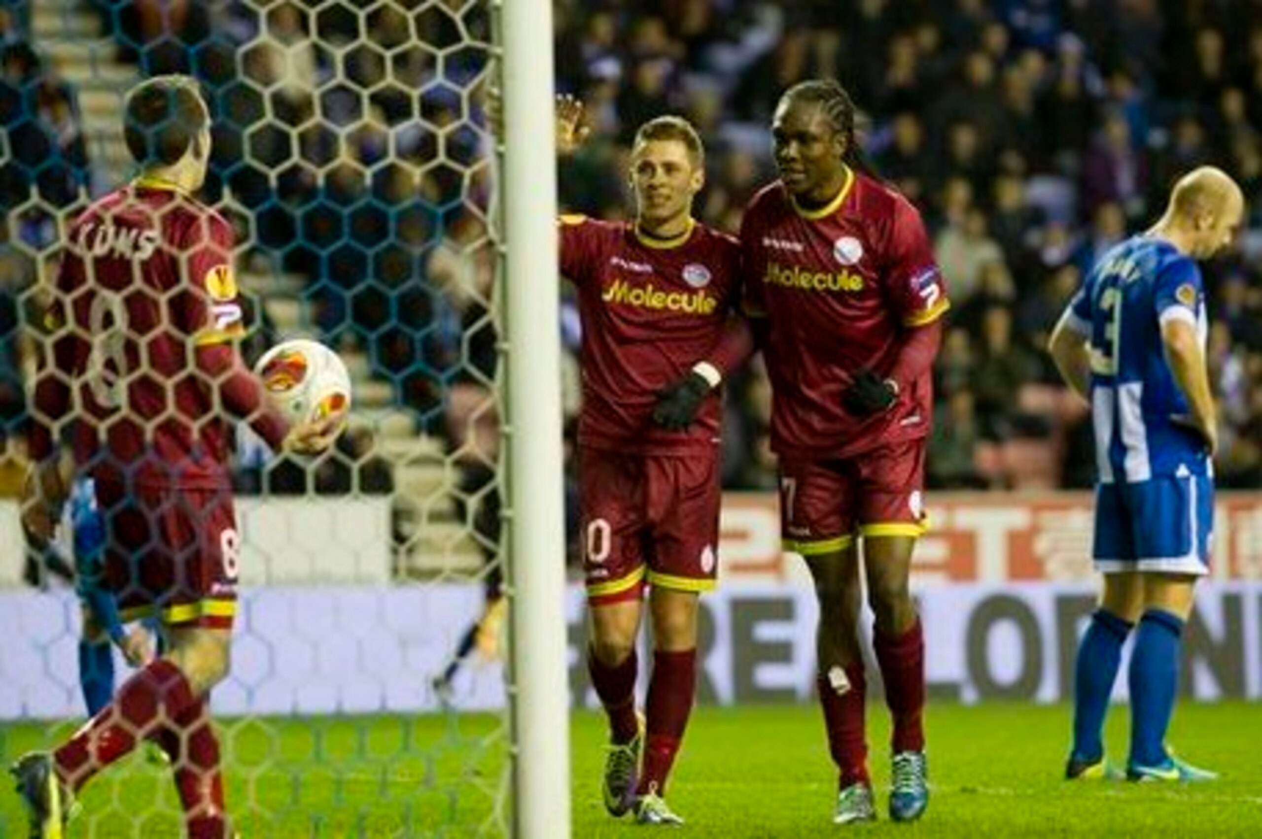 Thorgan Hazard celebrates with team-mates in Europa League.