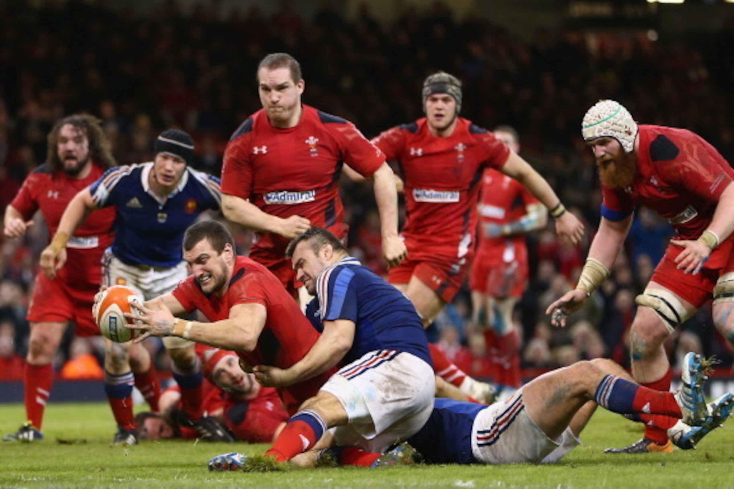 CARDIFF, WALES - FEBRUARY 21:  (EDITORS NOTE: THIS PICTURE IS A RECROP OF IMAGE 474015723) Sam Warburton of Wales scores a try as Nicolas Mas of fails to hold him up during the RBS Six Nations match between Wales and France at the Millennium Stadium on Fe