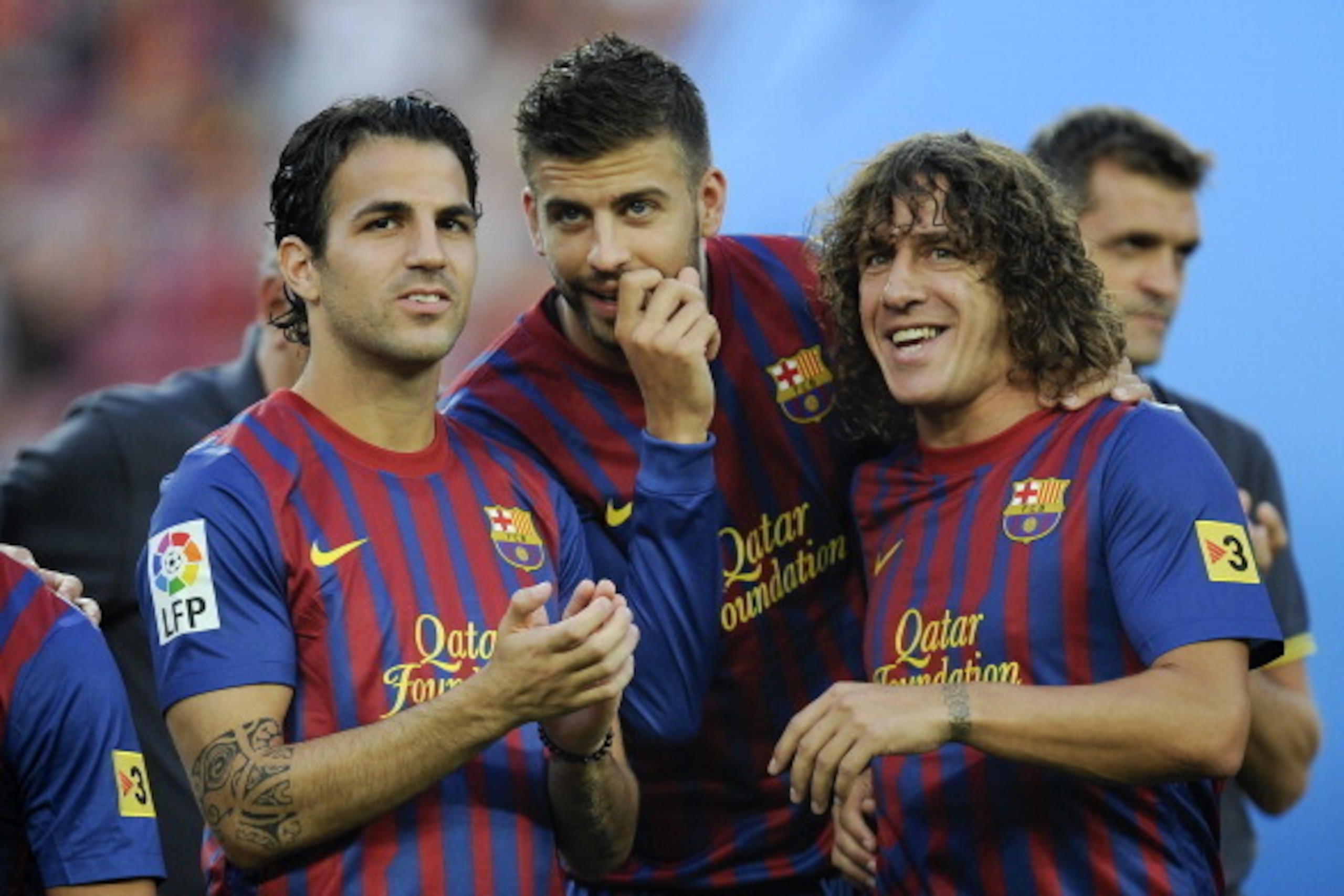 BARCELONA, SPAIN - AUGUST 22:  Cesc Fabregas (L) and Gerard Pique (C) and Carles Puyol of FC Barcelona joke prior the Joan Gamper Trophy match between FC Barcelona and SSC Napoli at the Camp Nou Stadium on August 22, 2011 in Barcelona, Spain.  (Photo by D