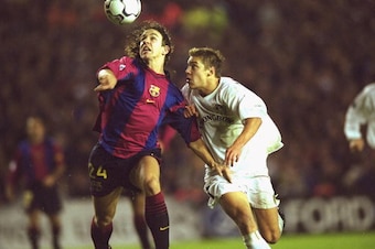 24 Oct 2000:  Carles Puyol of Barcelona holds off Alan Smith of Leeds United during the UEFA Champions League match played at Elland Road, in Leeds, England. The match ended in a 1-1 draw. \ Mandatory Credit: Shaun Botterill /Allsport