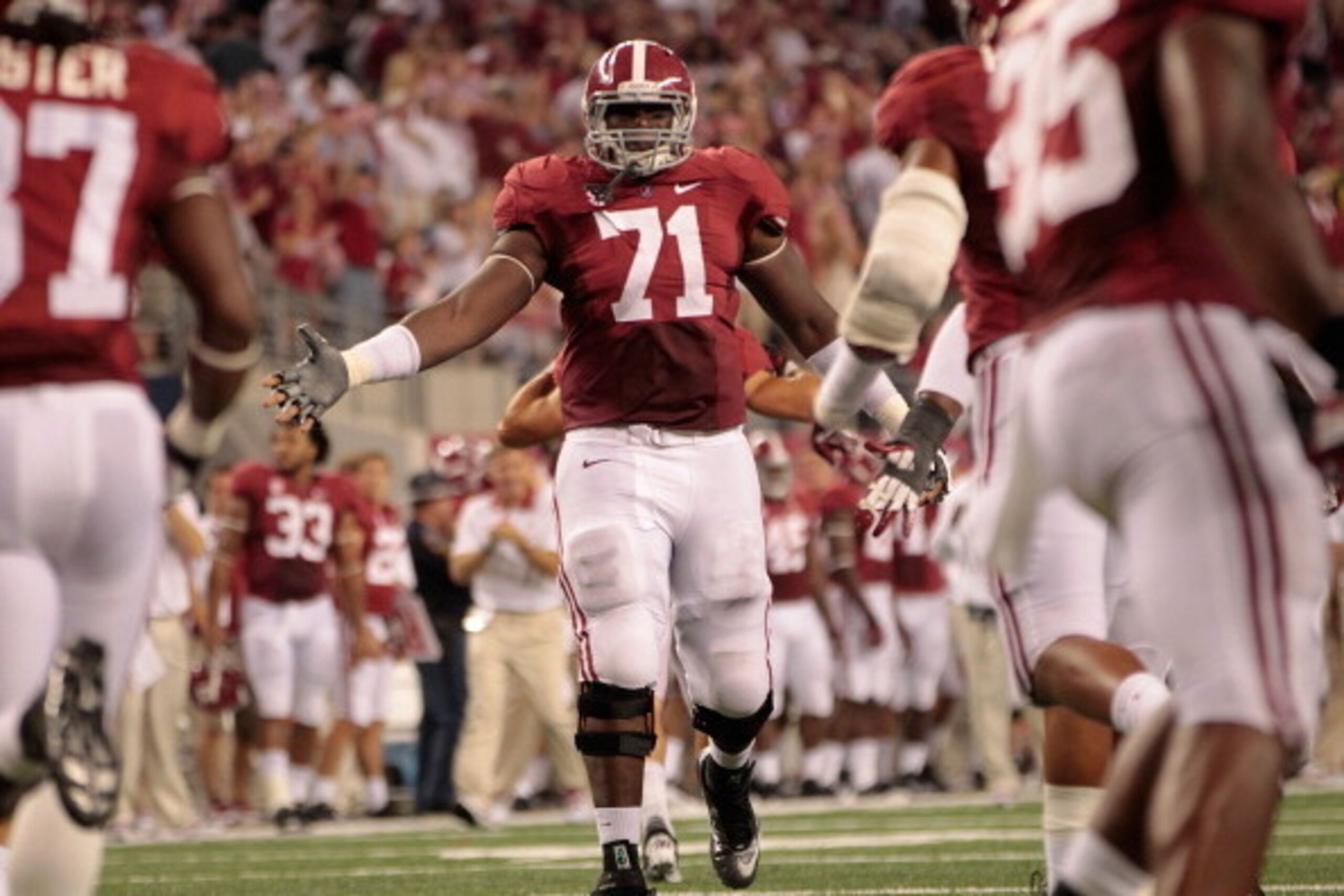 ARLINGTON, TX - SEPTEMBER 01: Cyrus Kouandjio #71 of the University of Alabama reacts after a big stop during the game against the University of Michigan at Cowboys Stadium on September 1, 2012 in Arlington, Texas. Alabama defeated Michigan 41-14.  (Photo