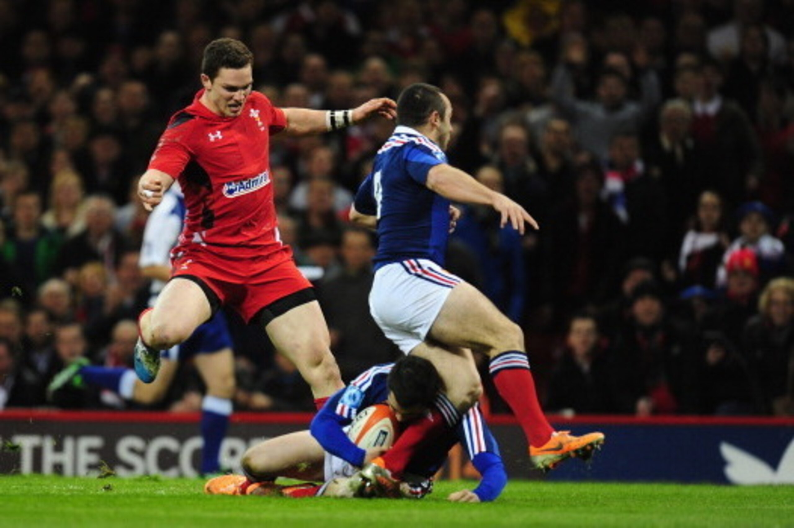 CARDIFF, WALES - FEBRUARY 21:  Wales centre George North (l) prepares to grab the loose ball to go over for the first try during the RBS Six Nations match between Wales and France at Millennium Stadium on February 21, 2014 in Cardiff, Wales.  (Photo by St