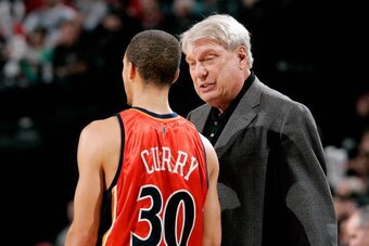 PORTLAND, OR - JANUARY 2:  Stephen Curry #30 listens to head coach Don Nelson of the Golden State Warriors during the game against the Portland Trail Blazers on January 2, 2010 at the Rose Garden in Portland, Oregon.  The Blazers won 105-85.  NOTE TO USER