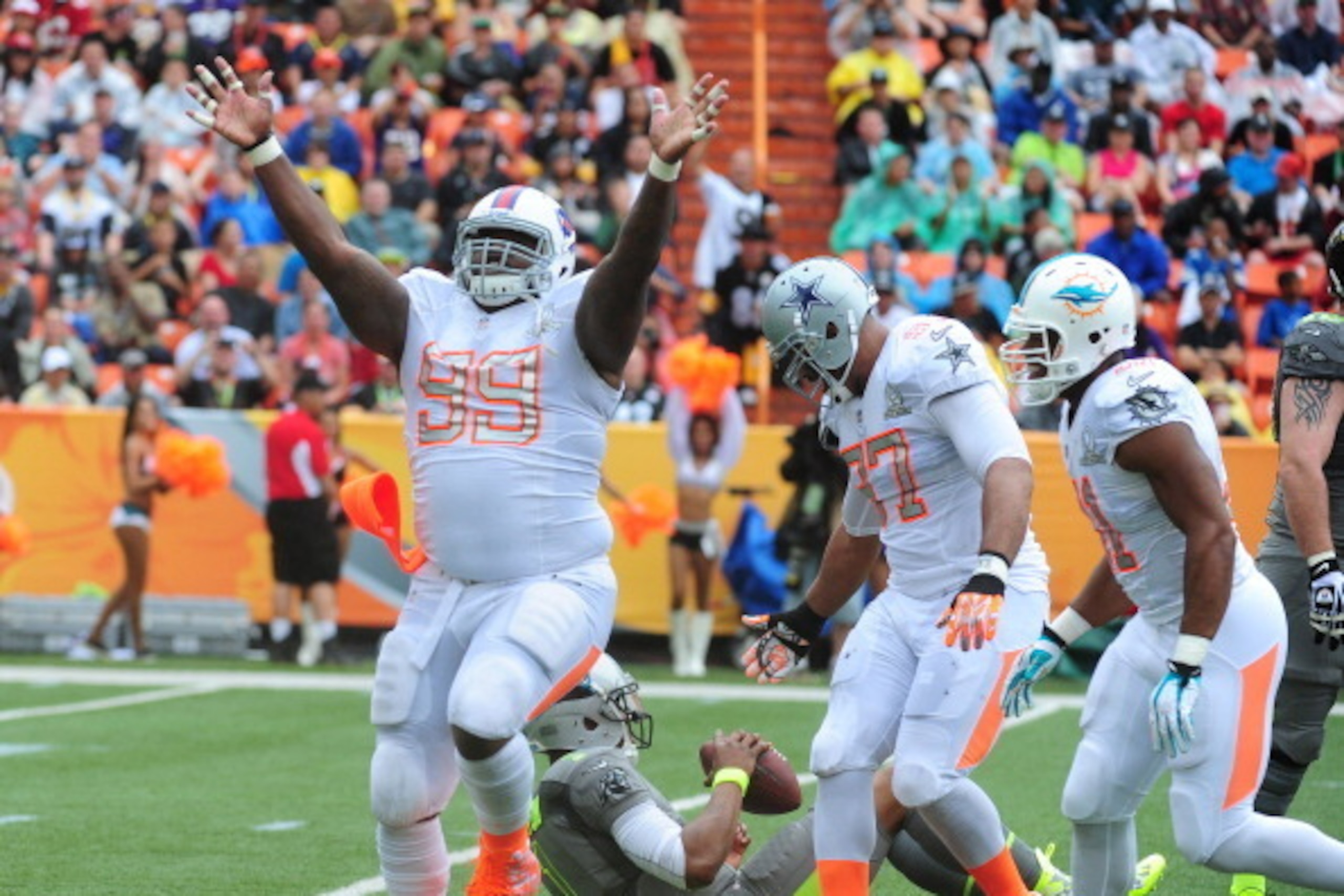 HONOLULU, HI - JANUARY 26: Marcell Dareus #99 of the Buffalo Bills and Team Rice celebrates after sacking Cam Newton #1 of the Carolina Panthers and Team Sanders during the 2014 Pro Bowl at Aloha Stadium on January 26, 2014 in Honolulu, Hawaii (Photo by HONOLULU, HI - JANUARY 26: Marcell Dareus #99 of the Buffalo Bills and Team Rice celebrates after sacking Cam Newton #1 of the Carolina Panthers and Team Sanders during the 2014 Pro Bowl at Aloha Stadium on January 26, 2014 in Honolulu, Hawaii (Photo by