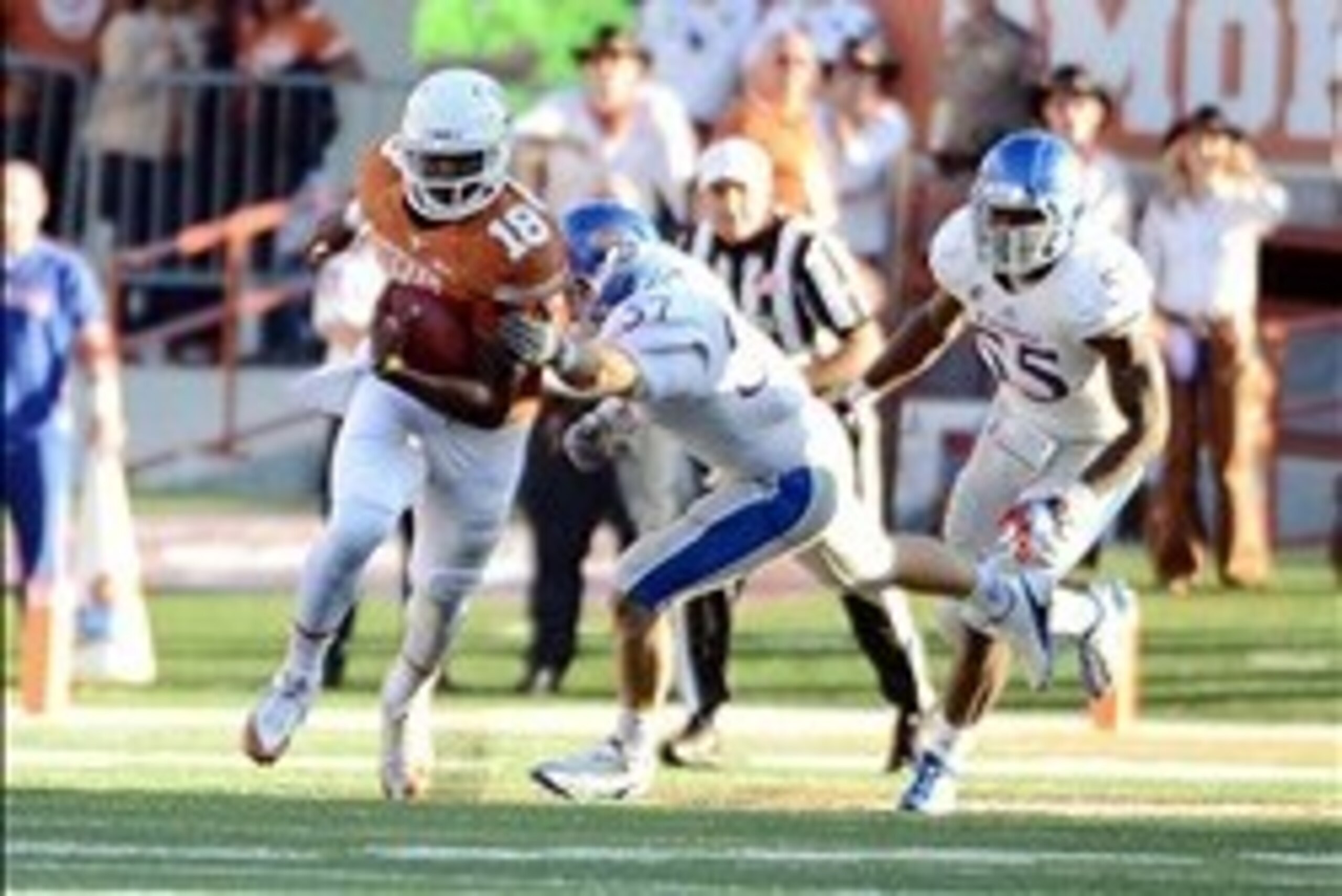 Nov 2, 2013; Austin, TX, USA; Texas Longhorns quarterback Tyrone Swoopes (18) runs the ball against the Kansas Jayhawks during the fourth quarter at Darrell K Royal-Texas Memorial Stadium. Texas beat Kansas 35-13. Mandatory Credit: Brendan Maloney-USA TOD