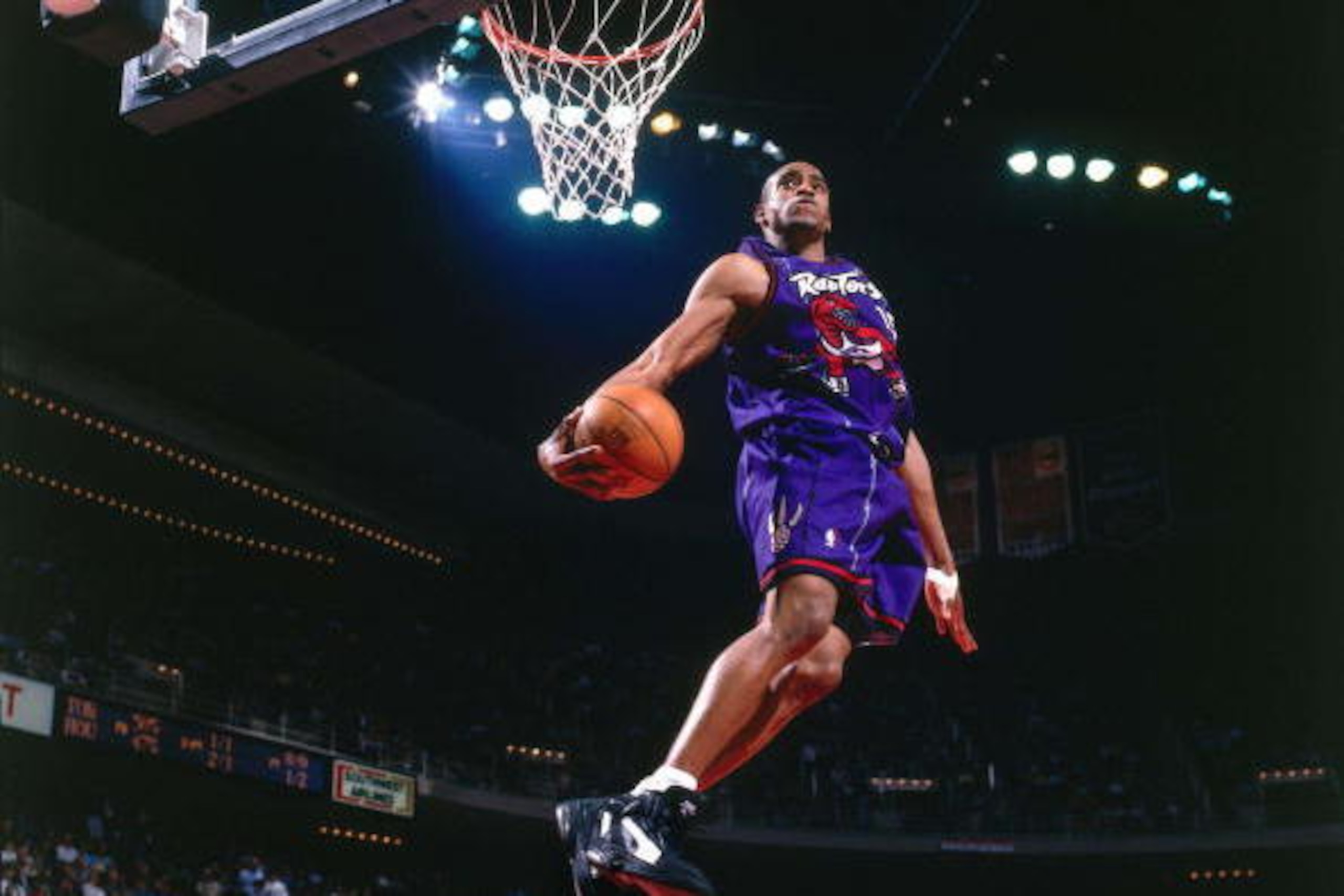 HOUSTON - 1999:  Vince Carter #15 of the Toronto Raptors elevates for a spectacular slam dunk against the Houston Rockets during a 1999 NBA game at the Summit in Houston, Texas.  NOTE TO USER: User expressly acknowledges that, by downloading and or using 