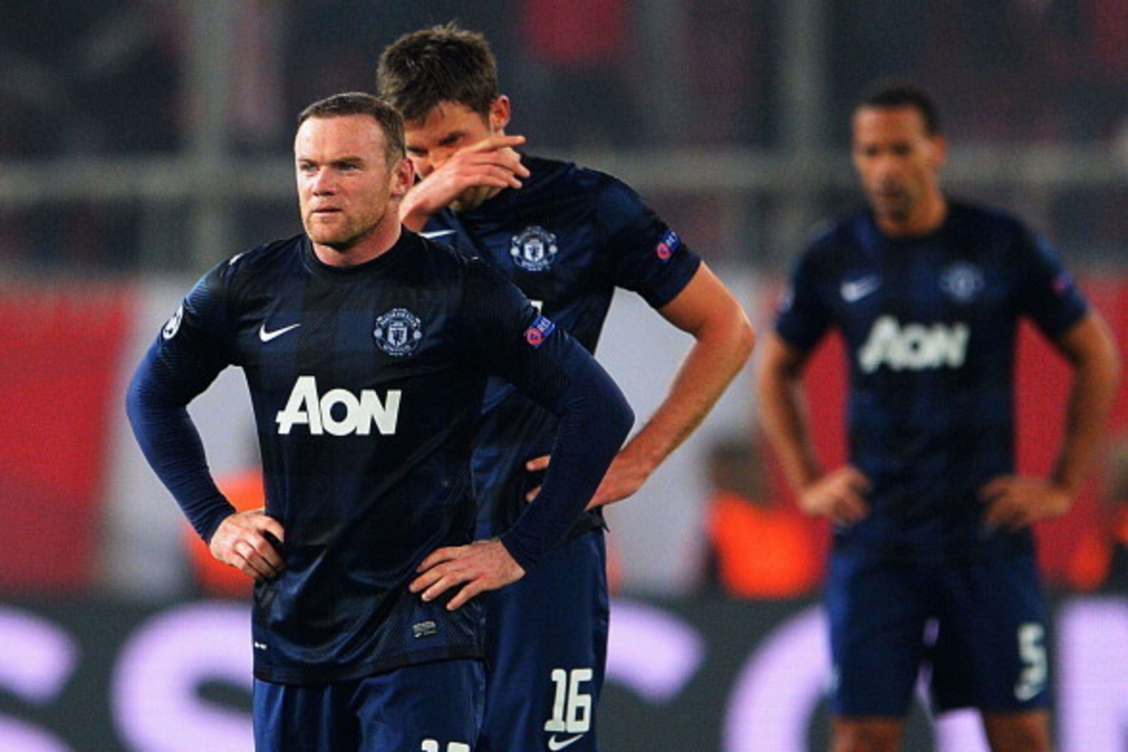 PIRAEUS, GREECE - FEBRUARY 25: (L-R) Wayne Rooney and Michael Carrick of Manchester United react as they restart the game after conceding their second goal during the UEFA Champions League Round of 16 first leg match between Olympiacos FC and Manchester PIRAEUS, GREECE - FEBRUARY 25: (L-R) Wayne Rooney and Michael Carrick of Manchester United react as they restart the game after conceding their second goal during the UEFA Champions League Round of 16 first leg match between Olympiacos FC and Manchester