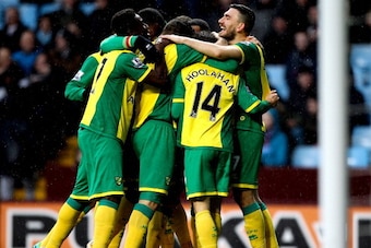BIRMINGHAM, ENGLAND - MARCH 02: Wes Hoolahan of Norwich celebrates with team mates after scoring the openng goal of the game during the Barclays Premier League match between Aston Villa and Norwich City at Villa Park on March 2, 2014 in Birmingham, Englan