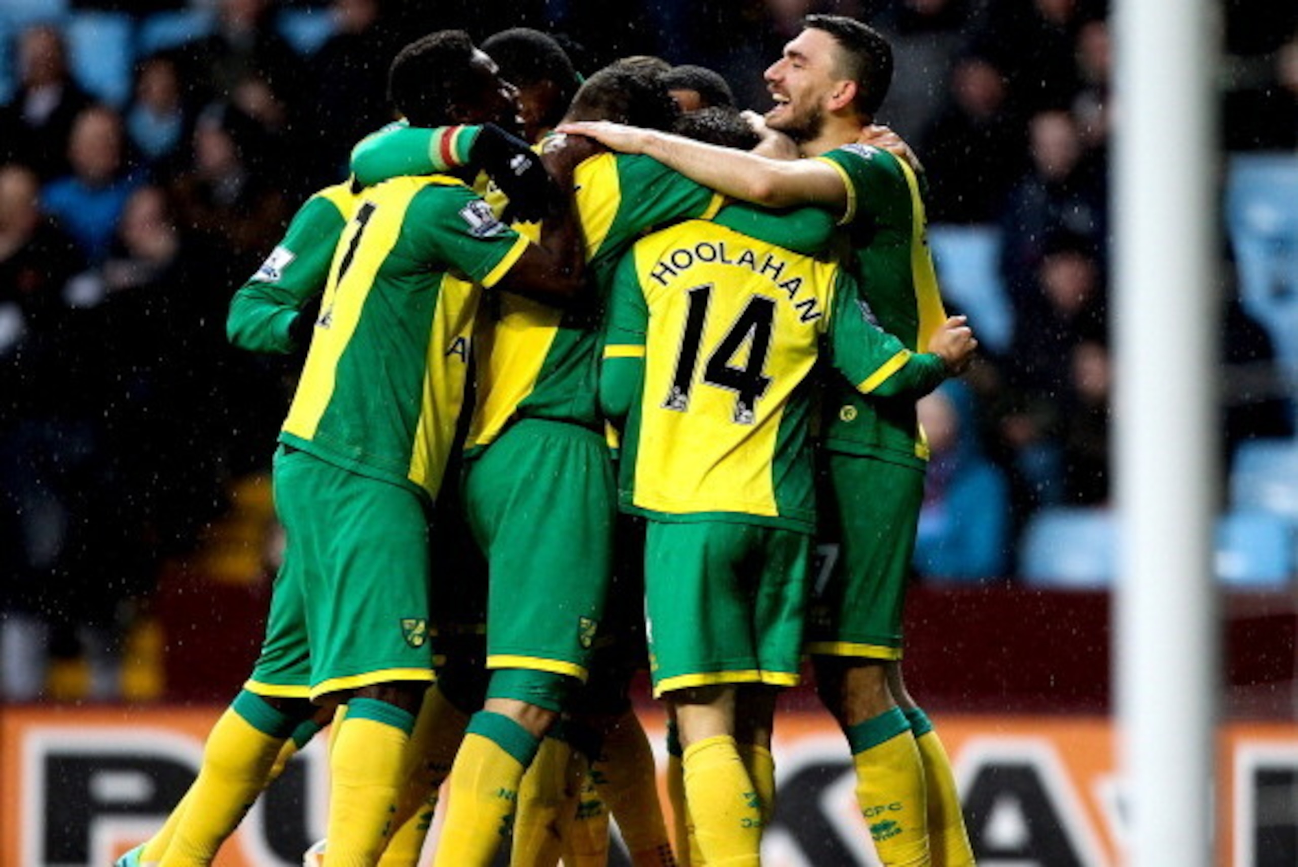 BIRMINGHAM, ENGLAND - MARCH 02: Wes Hoolahan of Norwich celebrates with team mates after scoring the openng goal of the game during the Barclays Premier League match between Aston Villa and Norwich City at Villa Park on March 2, 2014 in Birmingham, Englan