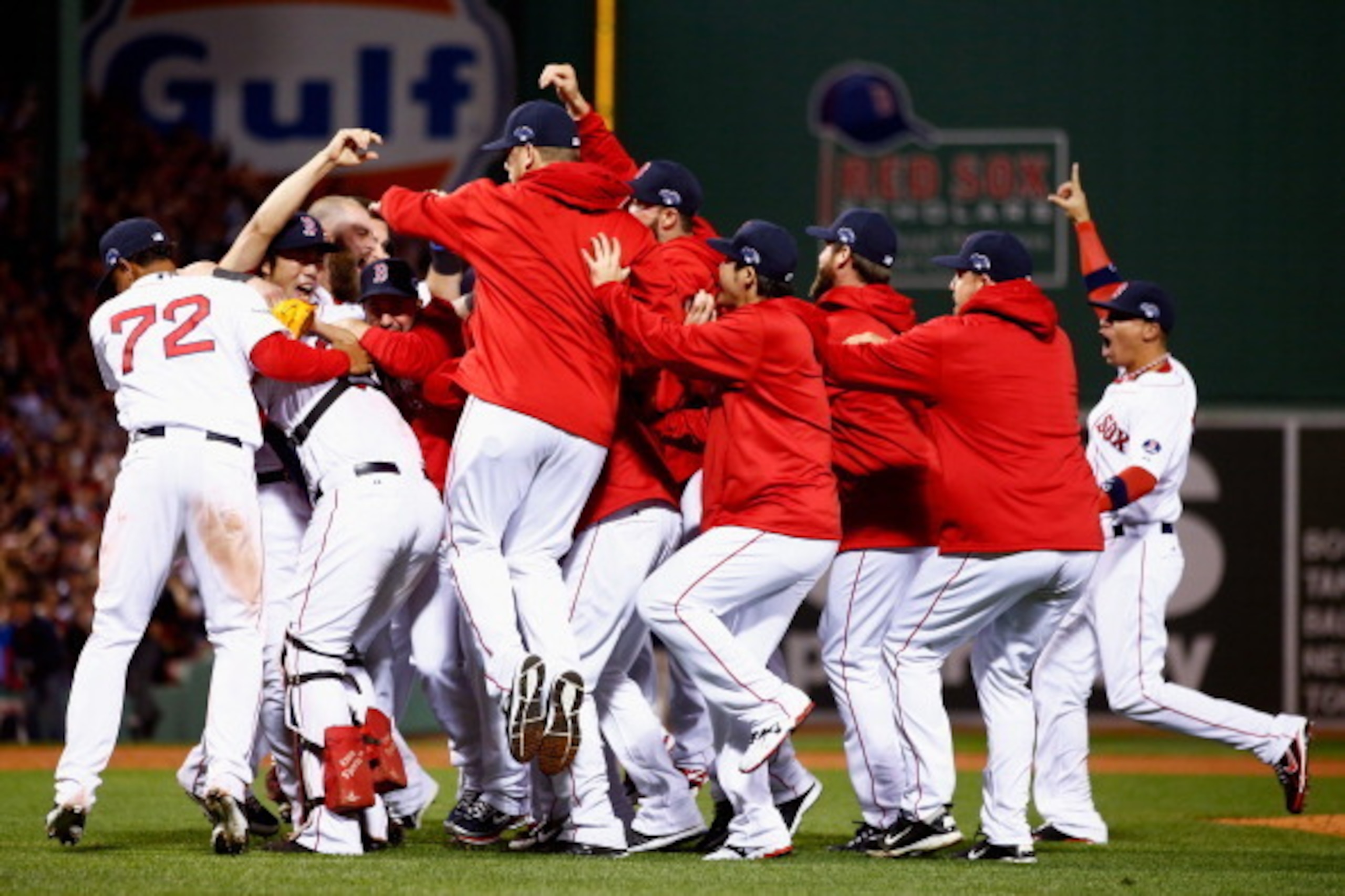 BOSTON, MA - OCTOBER 19:  The Boston Red Sox celebrate after defeating the Detroit Tigers in Game Six of the American League Championship Series at Fenway Park on October 19, 2013 in Boston, Massachusetts. The Red Sox defeated the Tigers 5-2 to clinch the