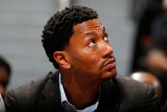 ATLANTA, GA - FEBRUARY 25:  Derrick Rose #1 of the Chicago Bulls looks on from the bench in their 107-103 win over the Atlanta Hawks at Philips Arena on February 25, 2014 in Atlanta, Georgia.  NOTE TO USER: User expressly acknowledges and agrees that, by 