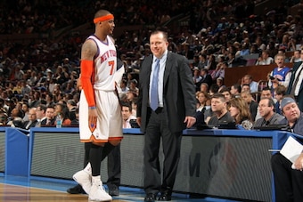 NEW YORK, NY - APRIL 12:  Head coach Tom Thibodeau of the Chicago Bulls talks to Carmelo Anthony #7 of the New York Knicks  during a game on April 12, 2011 at Madison Square Garden in New York City.  NOTE TO USER: User expressly acknowledges and agrees th