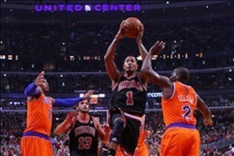 Oct 31, 2013; Chicago, IL, USA; Chicago Bulls point guard Derrick Rose (center) leaps between New York Knicks small forward Carmelo Anthony (left) and point guard Raymond Felton (right) during the second half at the United Center. Chicago won 82-81. Manda