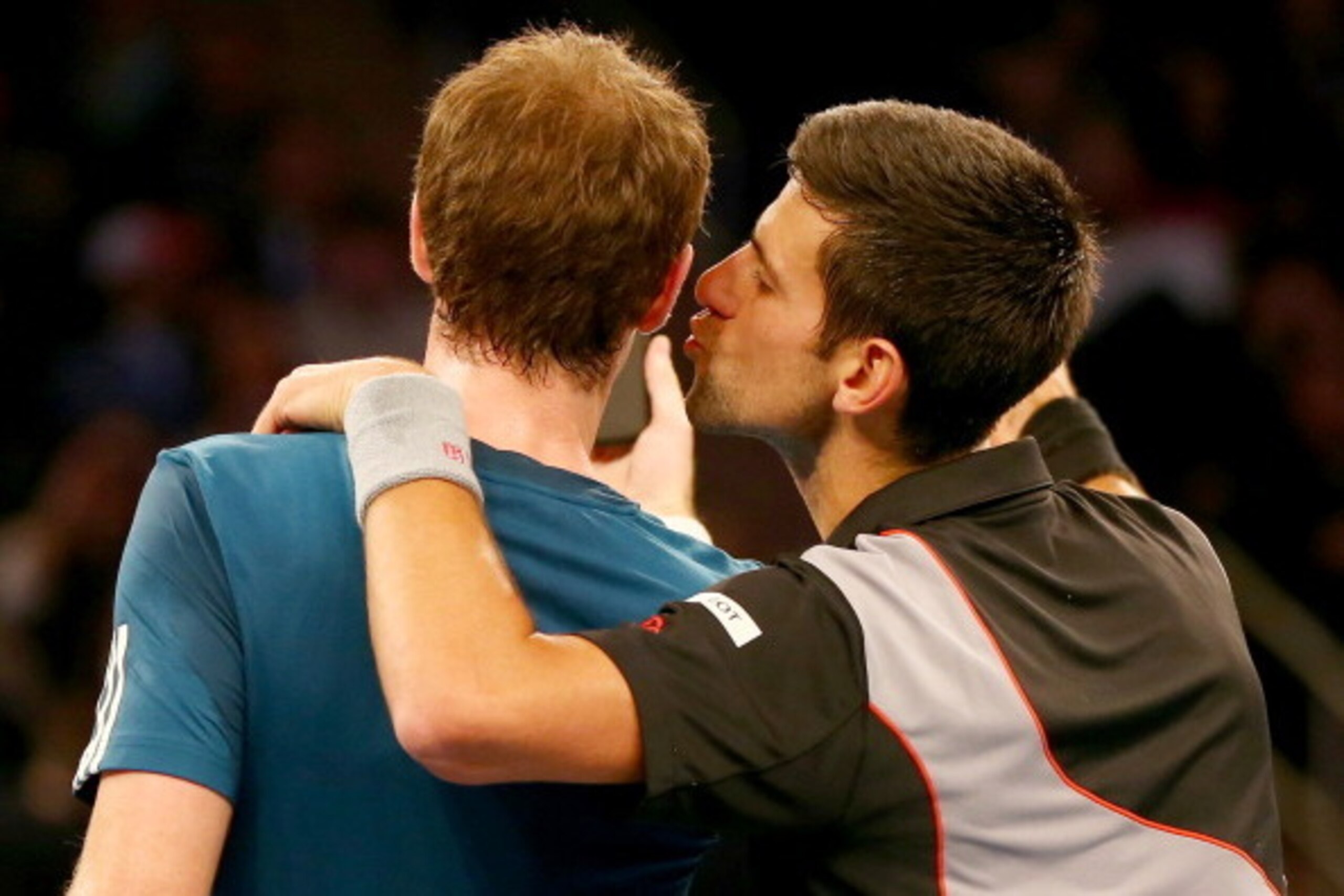 NEW YORK, NY - MARCH 03:  Novak Djokovic of Serbia pretends to kiss Andy Murray of Great Britain as they take selfies with their phones during the BNP Paribas Showdown at Madison Square Garden on March 3, 2014 in New York City.  (Photo by Elsa/Getty Image