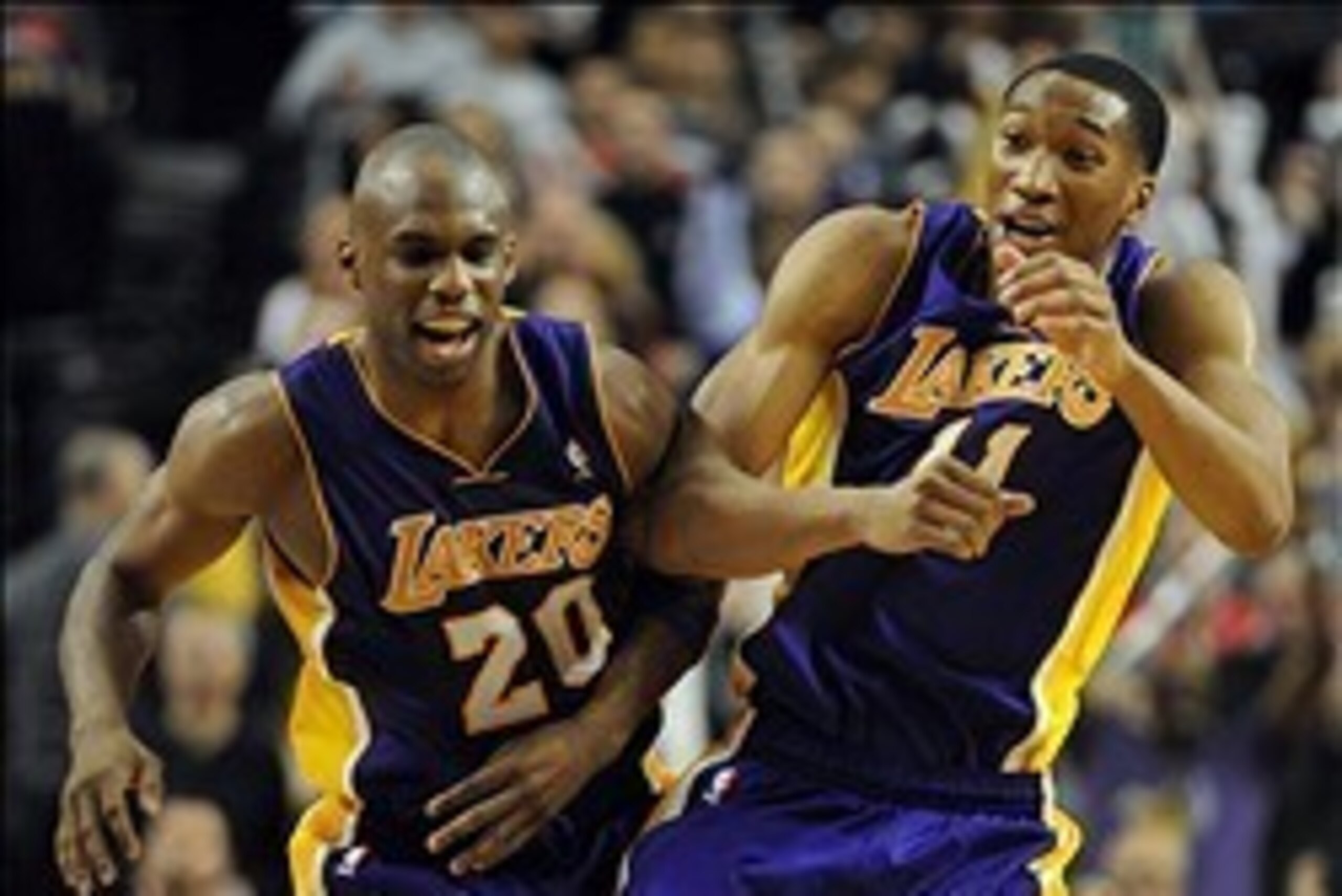 Mar 3, 2014; Portland, OR, USA; Los Angeles Lakers small forward Wesley Johnson (11)  celebrates with shooting guard Jodie Meeks (20) after he hit the game winning shot late in the fourth quarter of the game against the Portland Trail Blazers at the Moda 